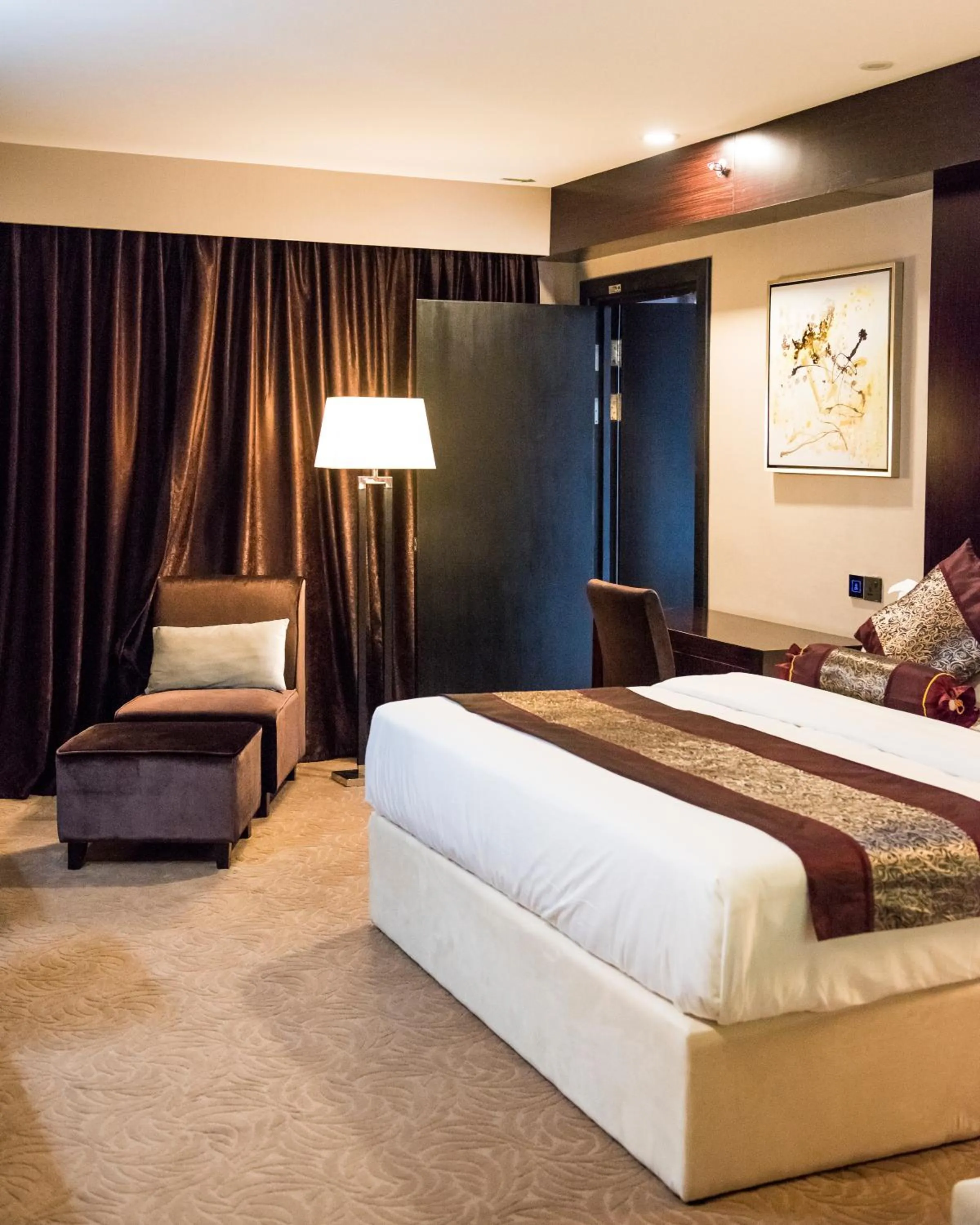 Bed in Royale Signature Hotel