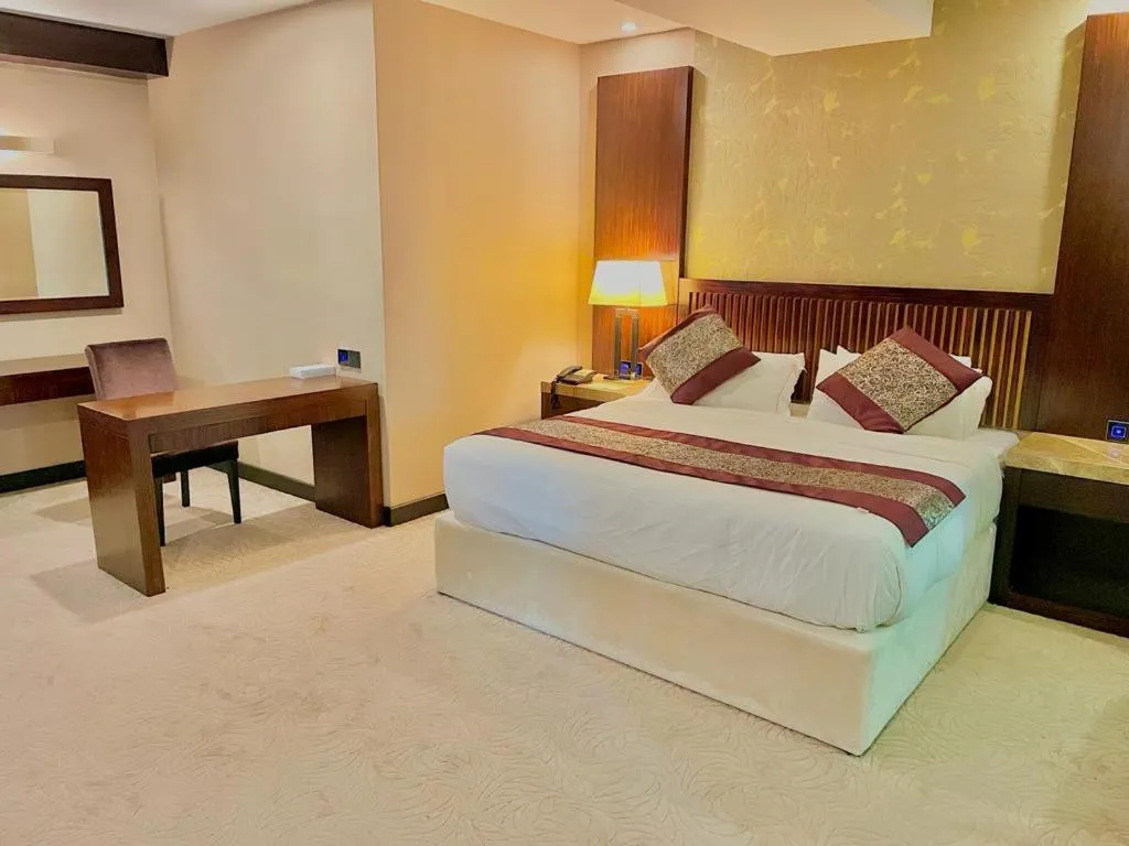 Bed in Royale Signature Hotel