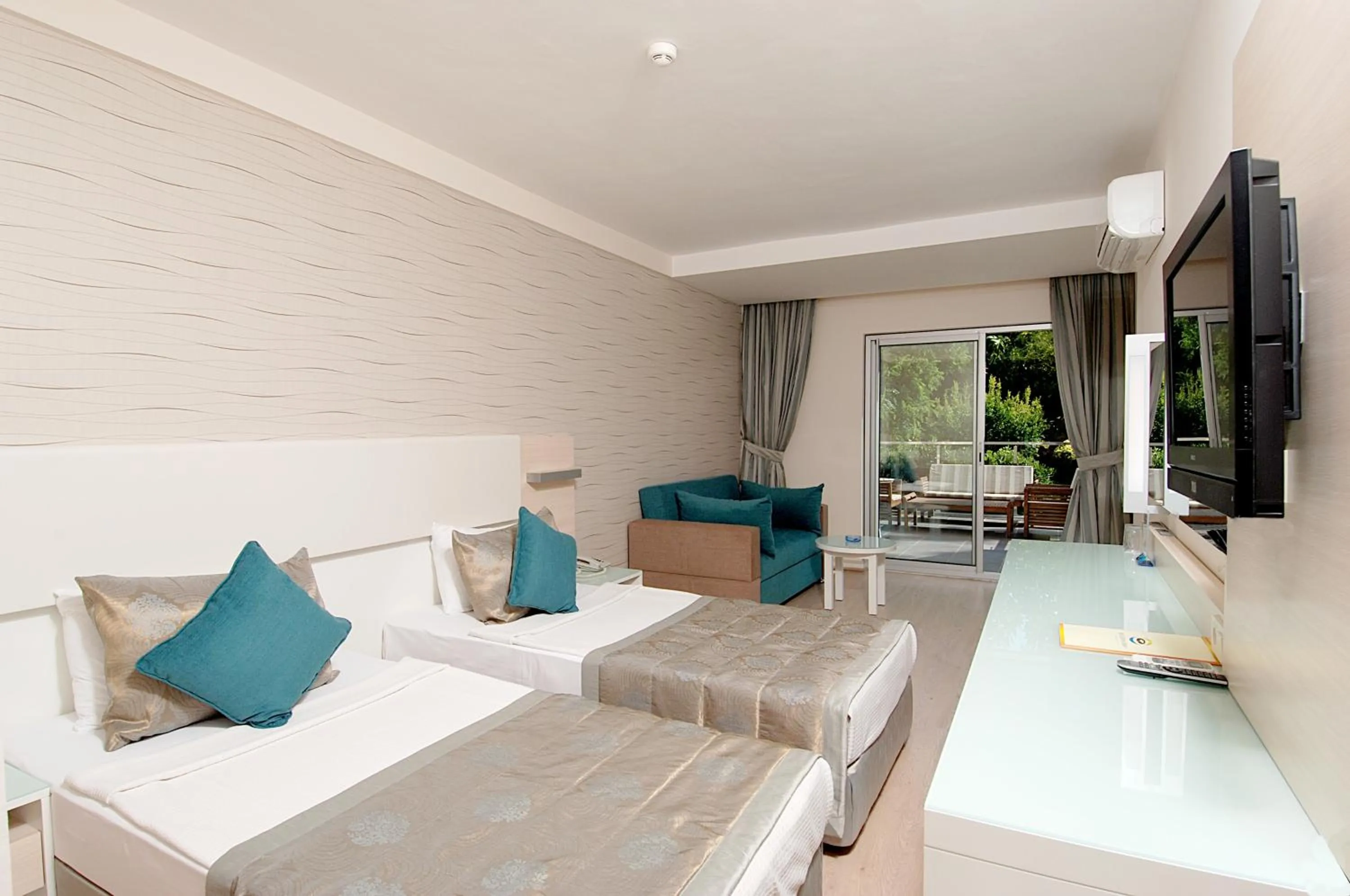 Bed in Grand Okan Hotel