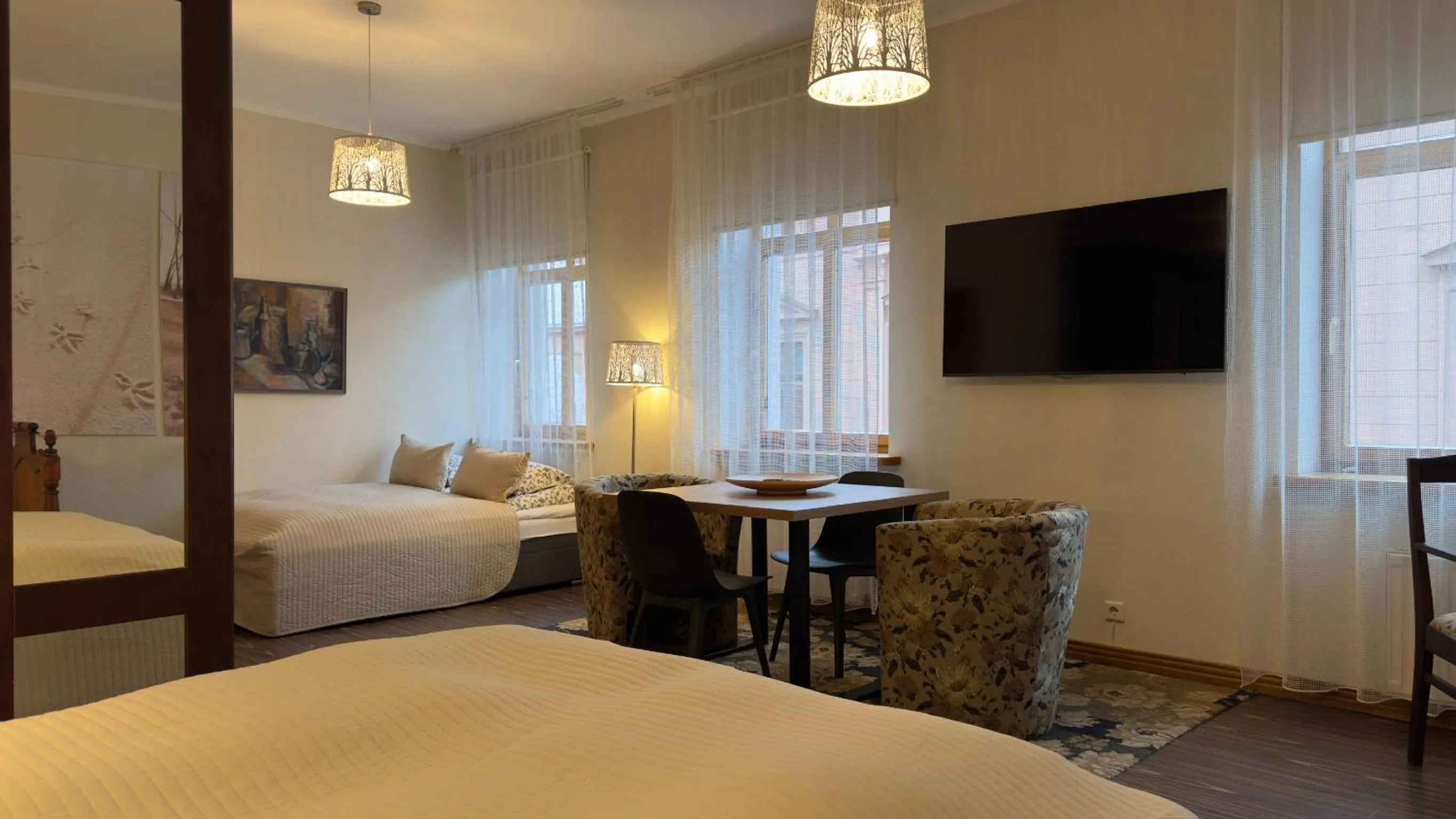 Communal lounge/ TV room, Bed in Hotel Vilhelmine