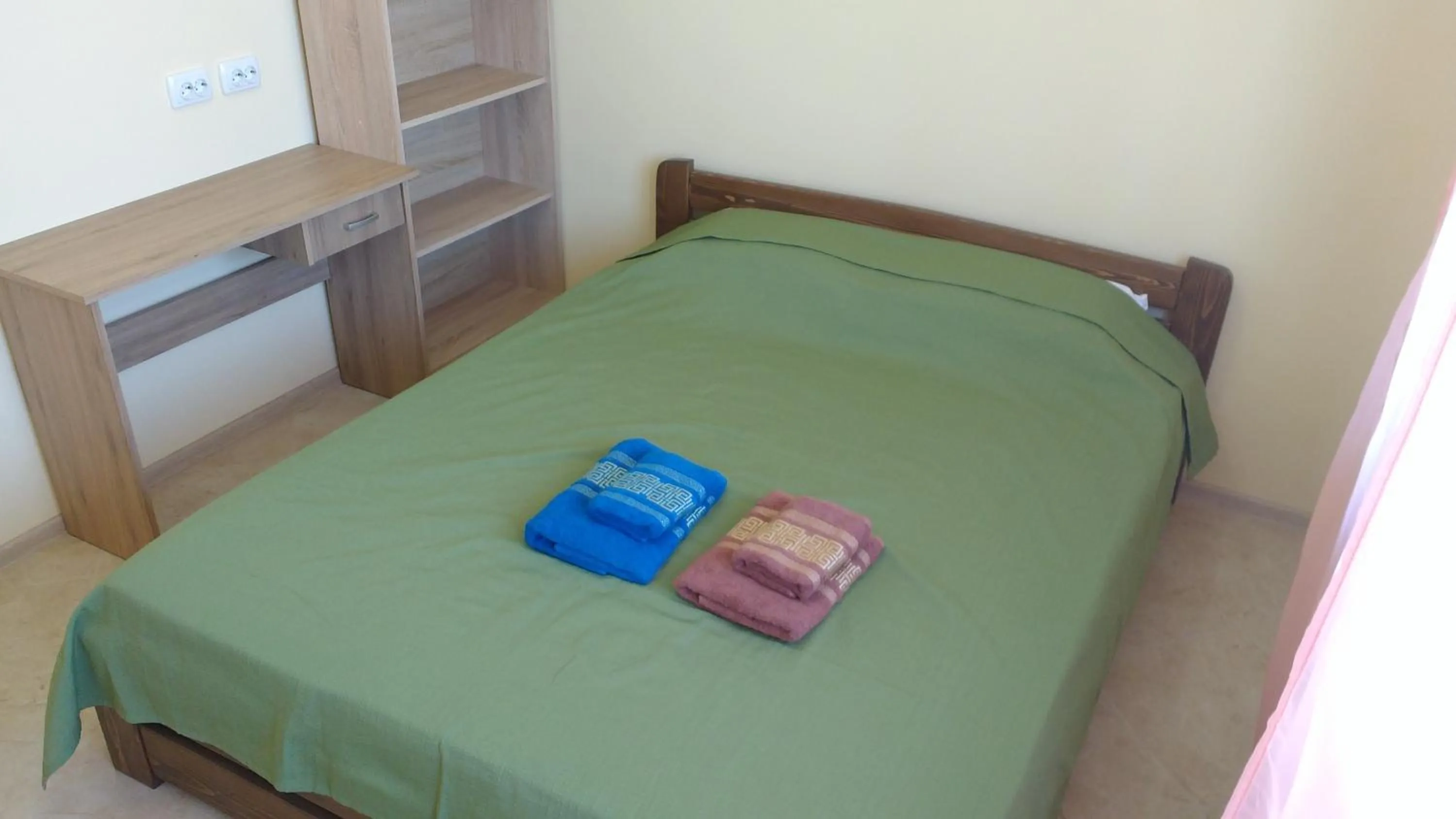 Bed in Orange Guest Rooms