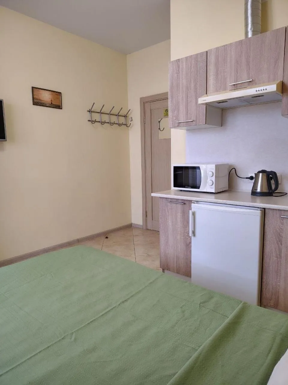 Kitchen or kitchenette, Bed in Orange Guest Rooms