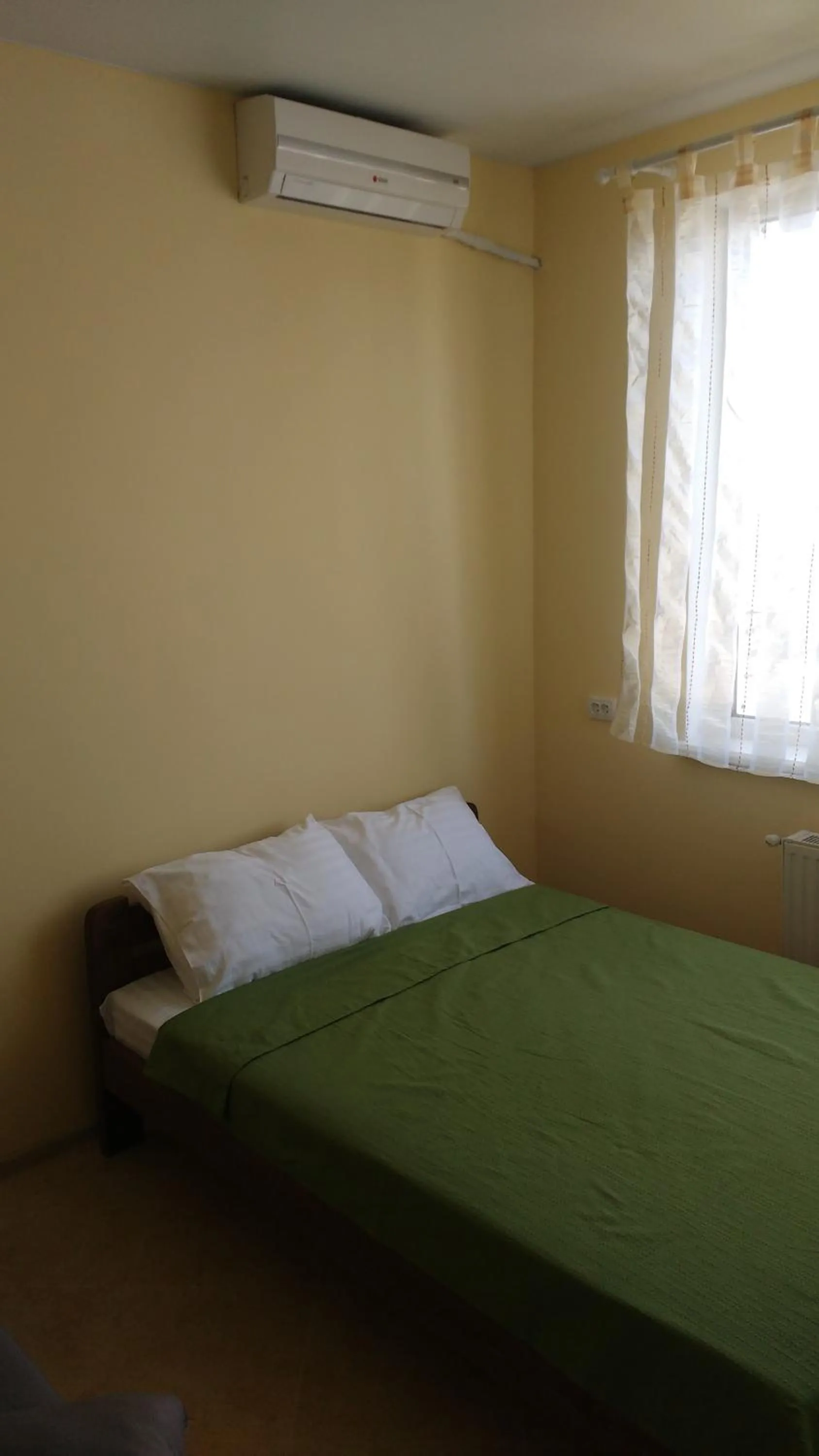 Bed in Orange Guest Rooms