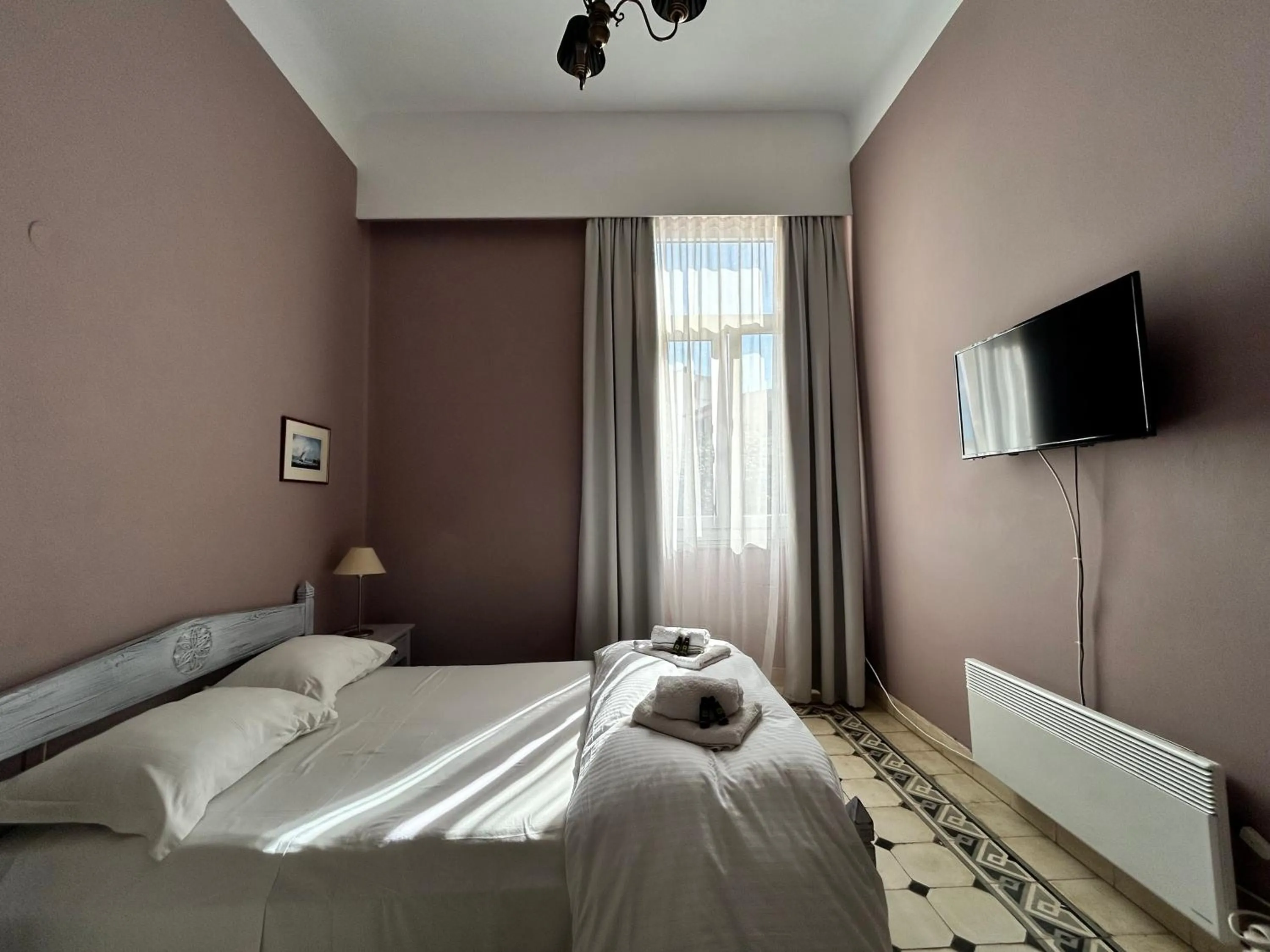 Bed in Tinion Urban Hotel