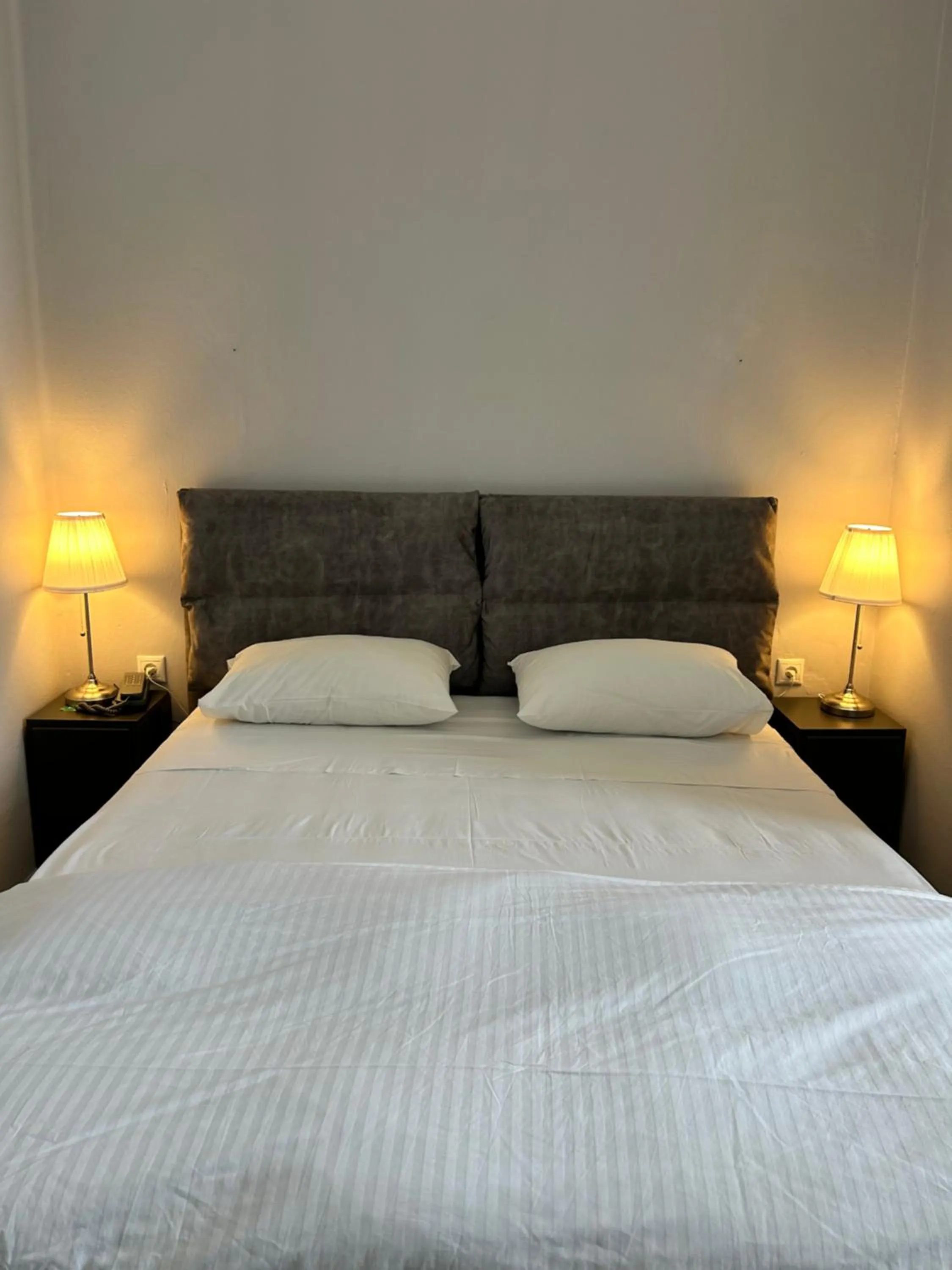 Bed in Tinion Urban Hotel