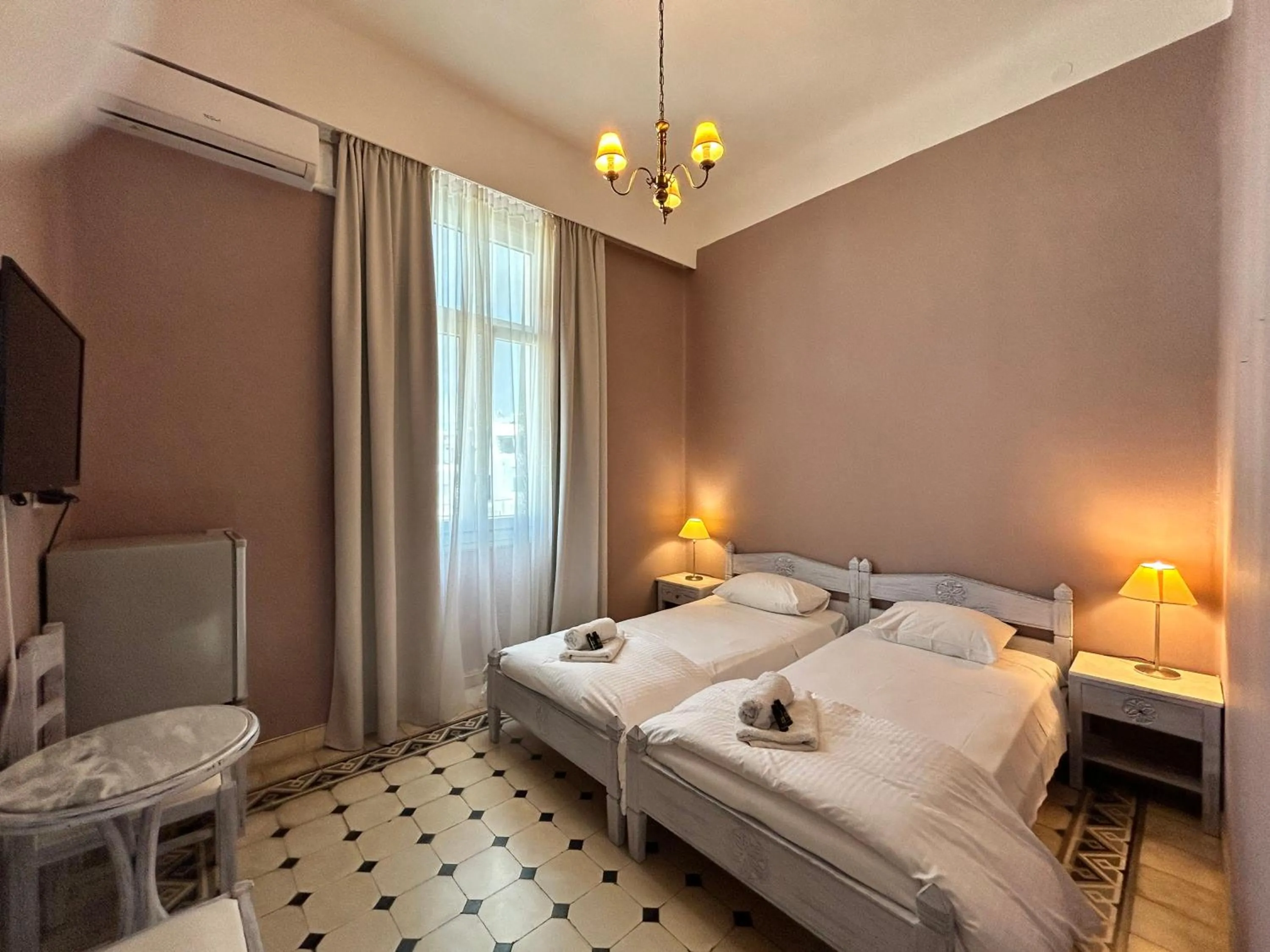 Bed in Tinion Urban Hotel