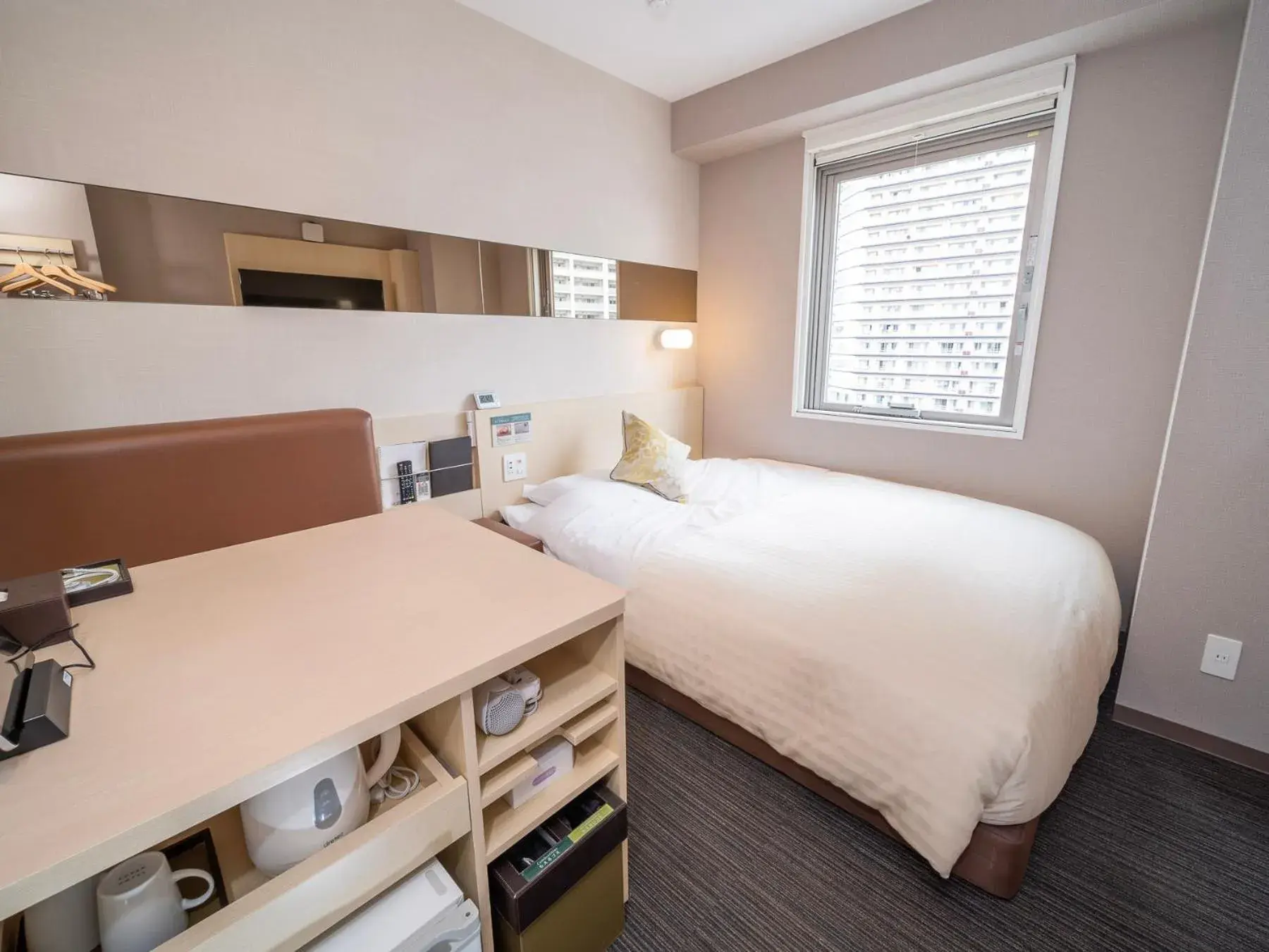 Bed in Super Hotel Premier Musashi Kosugi Ekimae Bed in Super Hotel Premier Musashi Kosugi Ekimae