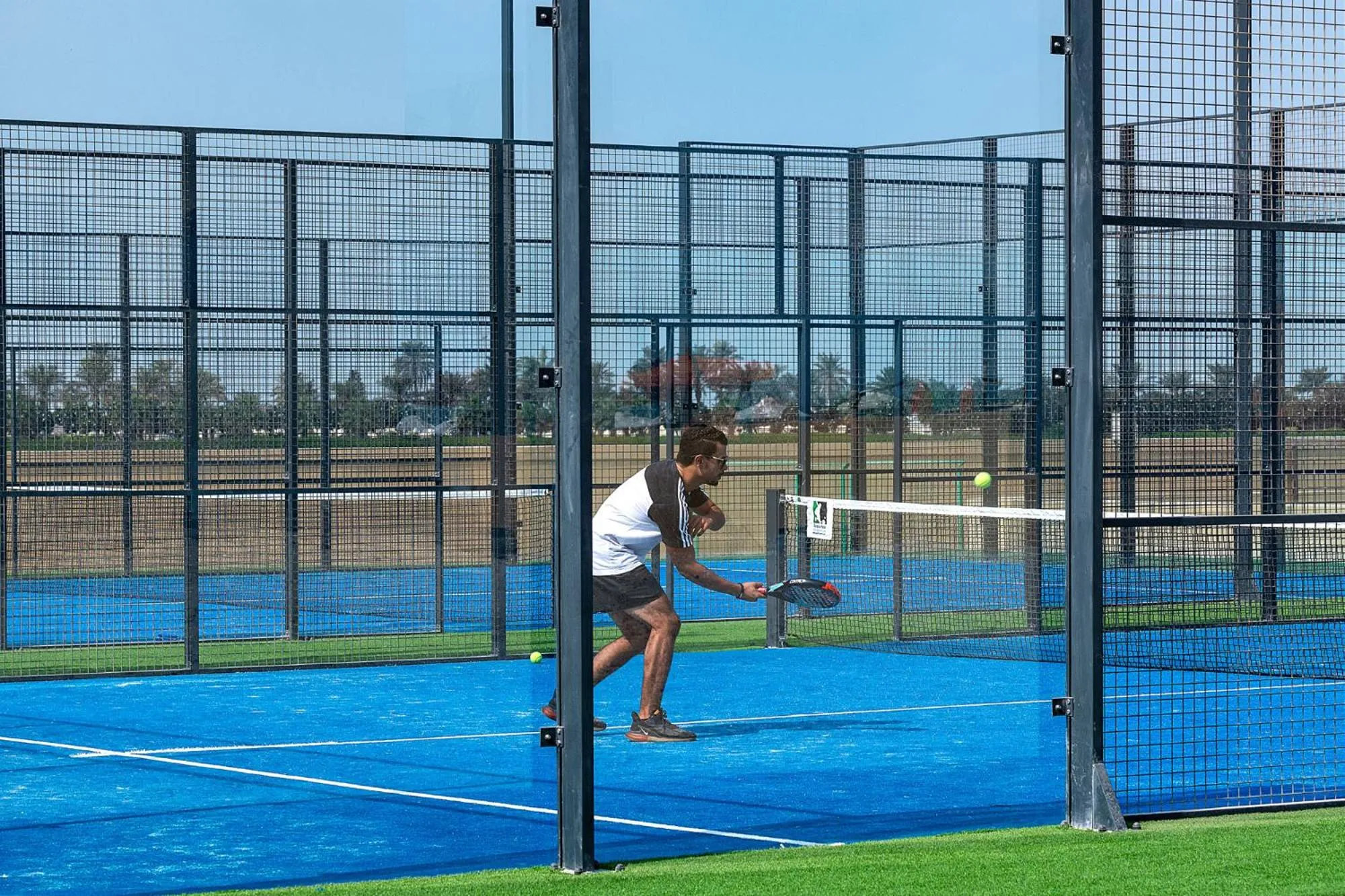 Tennis court in The Grove Resort Bahrain