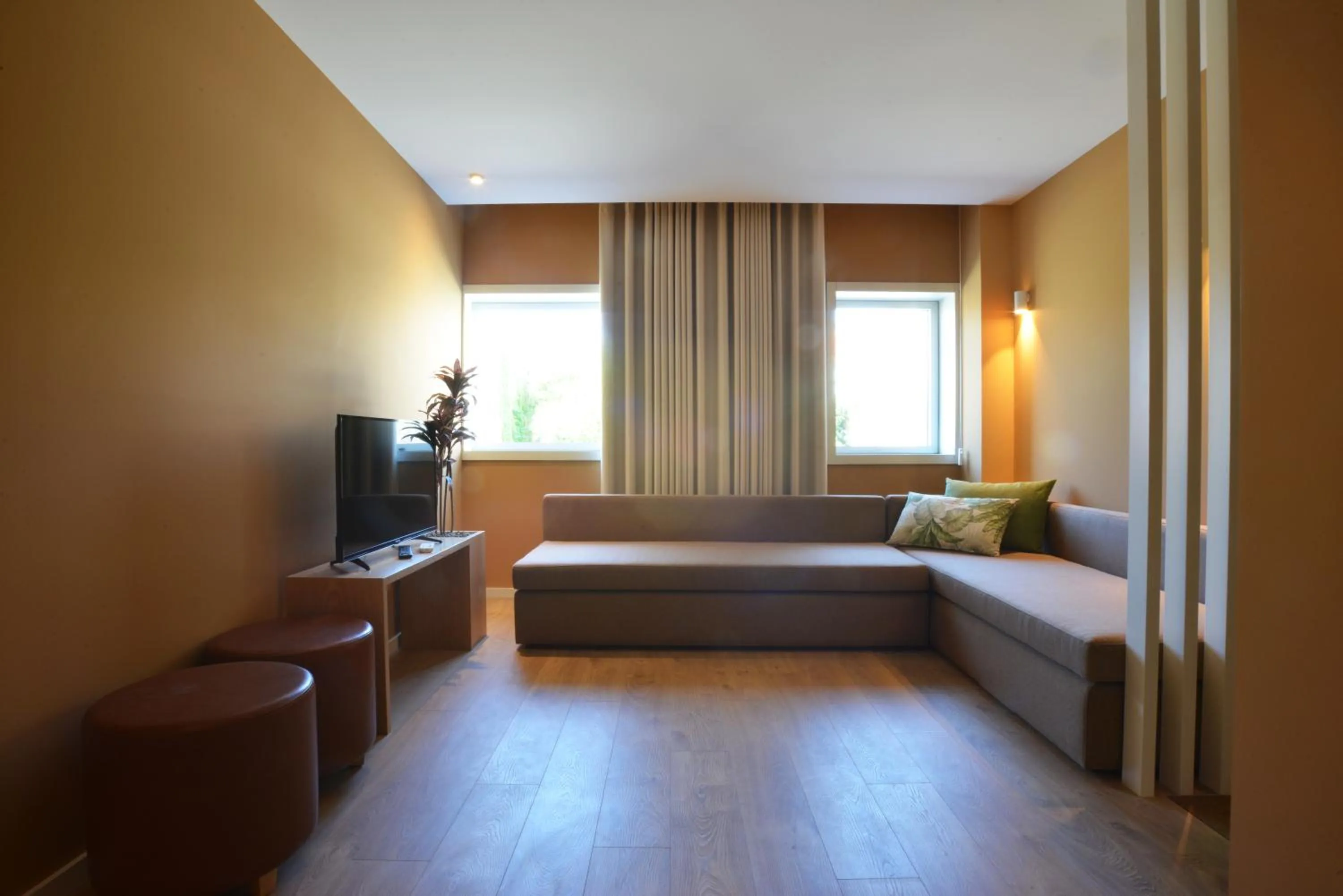 Living room, Bed in Spot Family Apartments