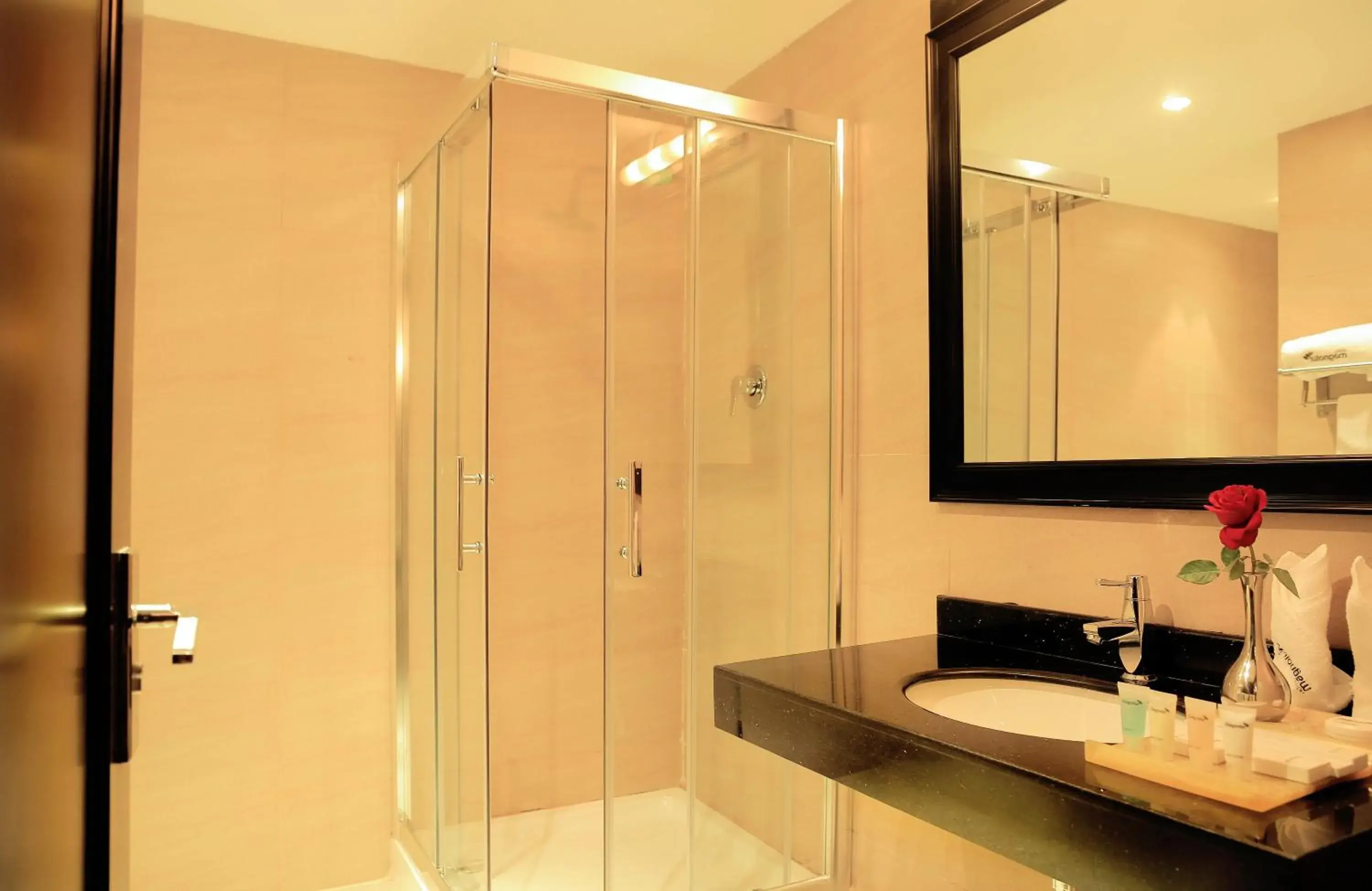 Bathroom in Magnolia Hotel & Conference Center Bathroom in Magnolia Hotel & Conference Center