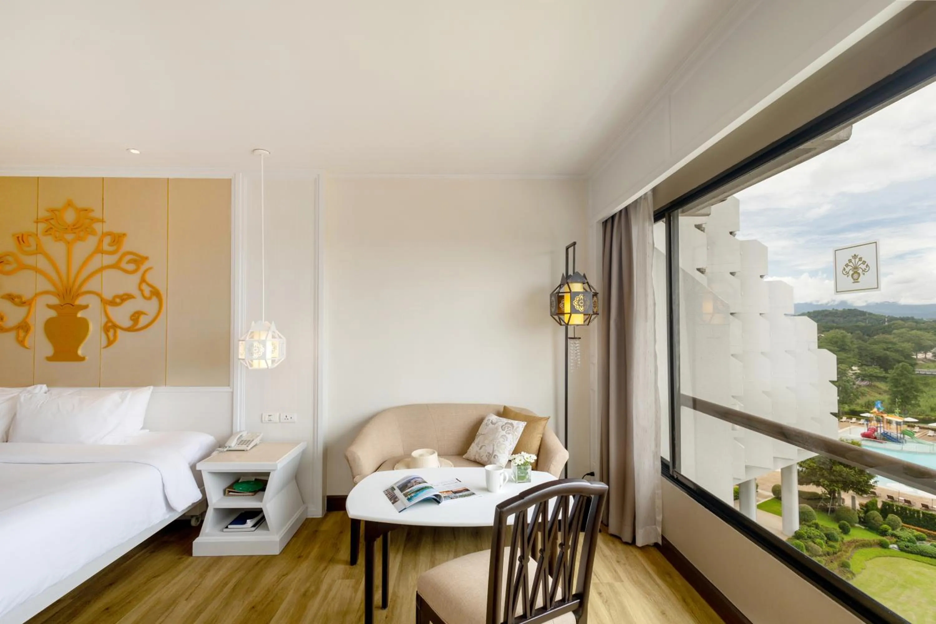 Seating area, Bed in The Riverie by Katathani