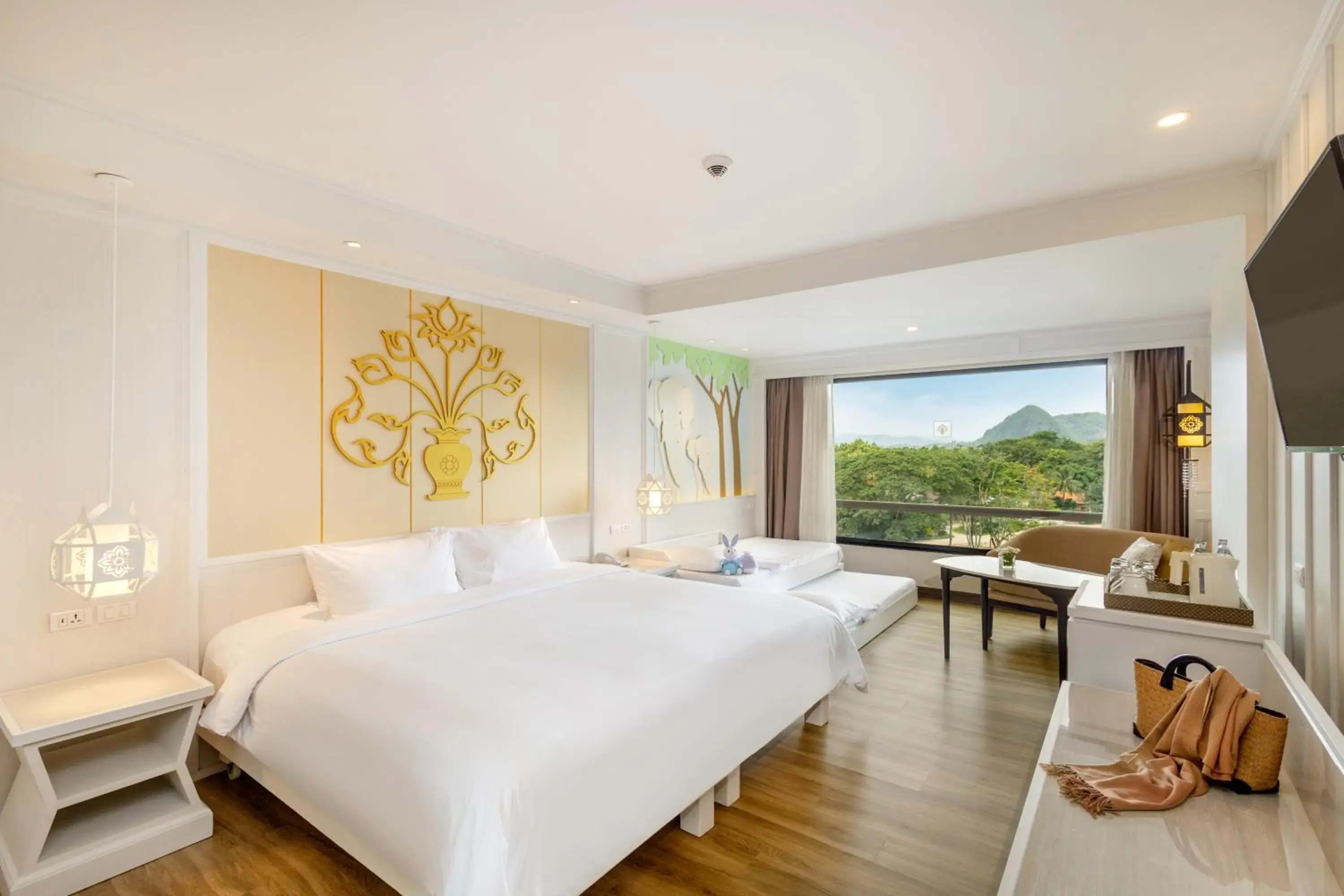 Seating area, Bed in The Riverie by Katathani Seating area, Bed in The Riverie by Katathani