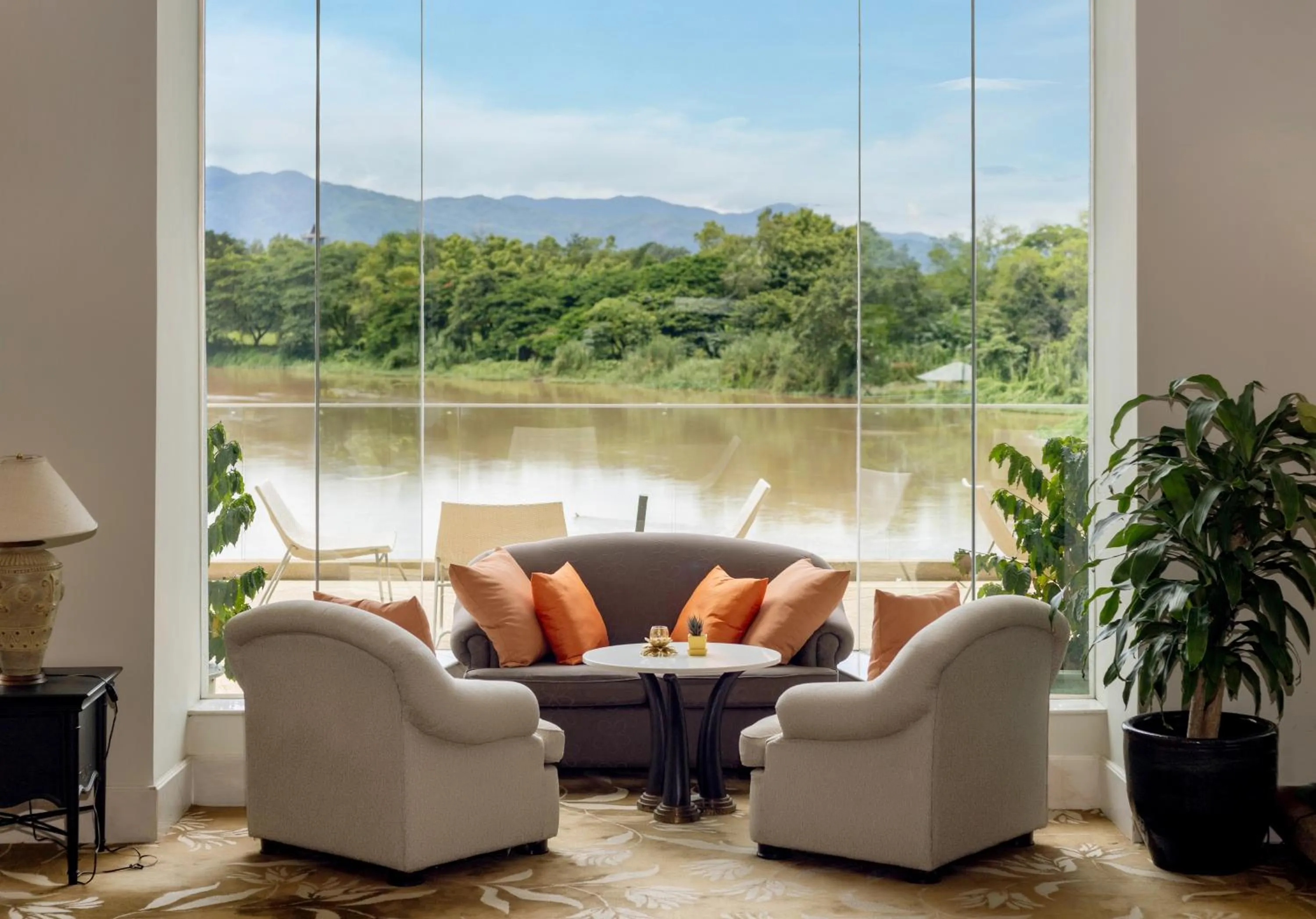 Seating area in The Riverie by Katathani