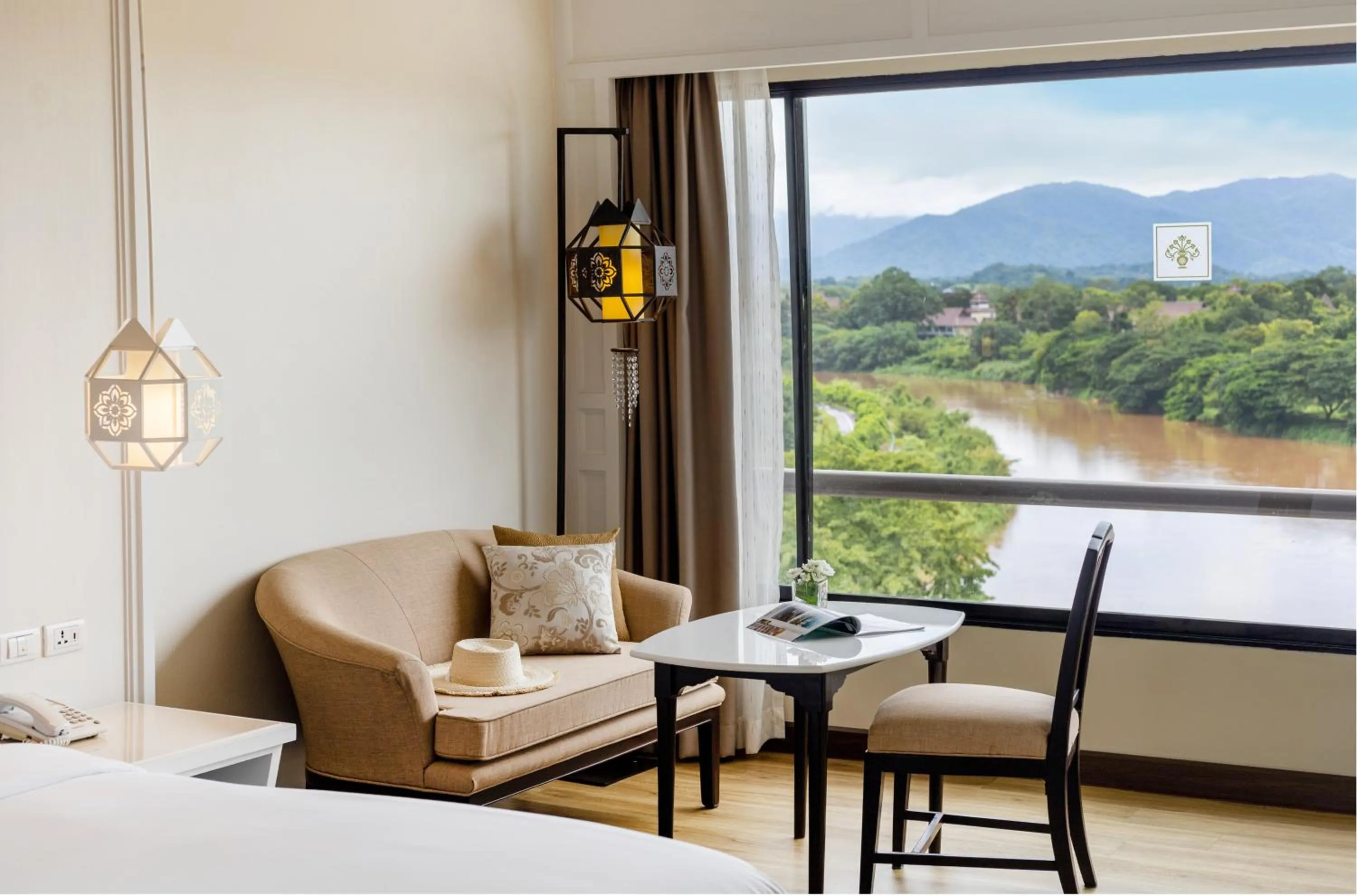 Seating area in The Riverie by Katathani