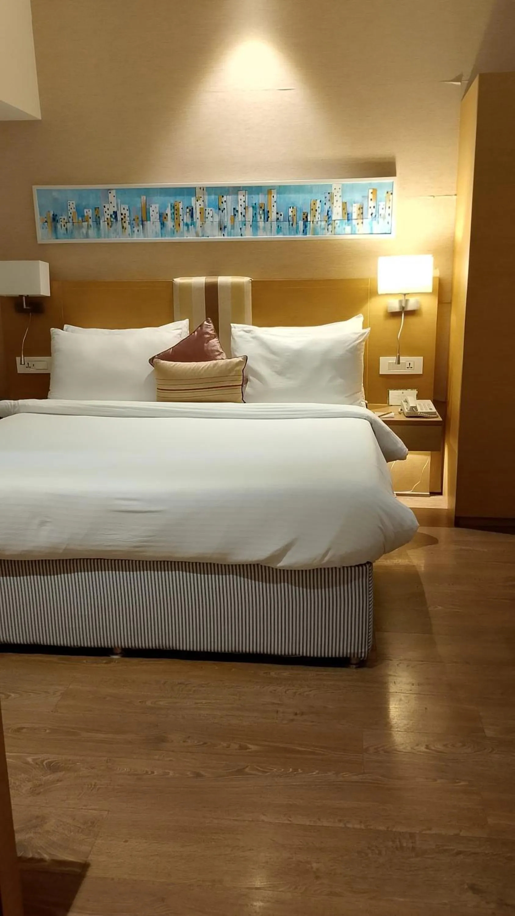 Bed in Sarovar Portico Rivera Ahmedabad