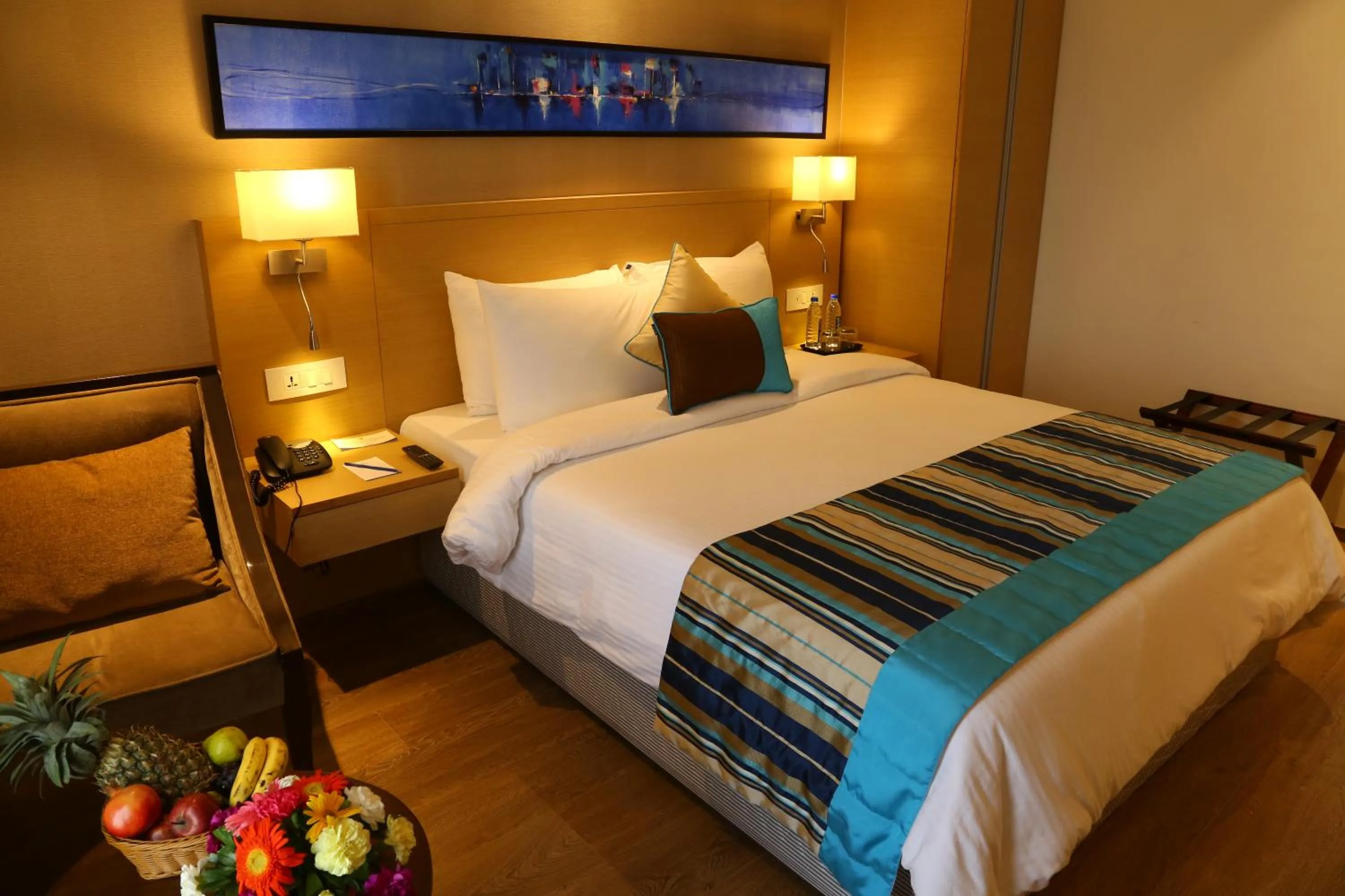 Bed in Sarovar Portico Rivera Ahmedabad