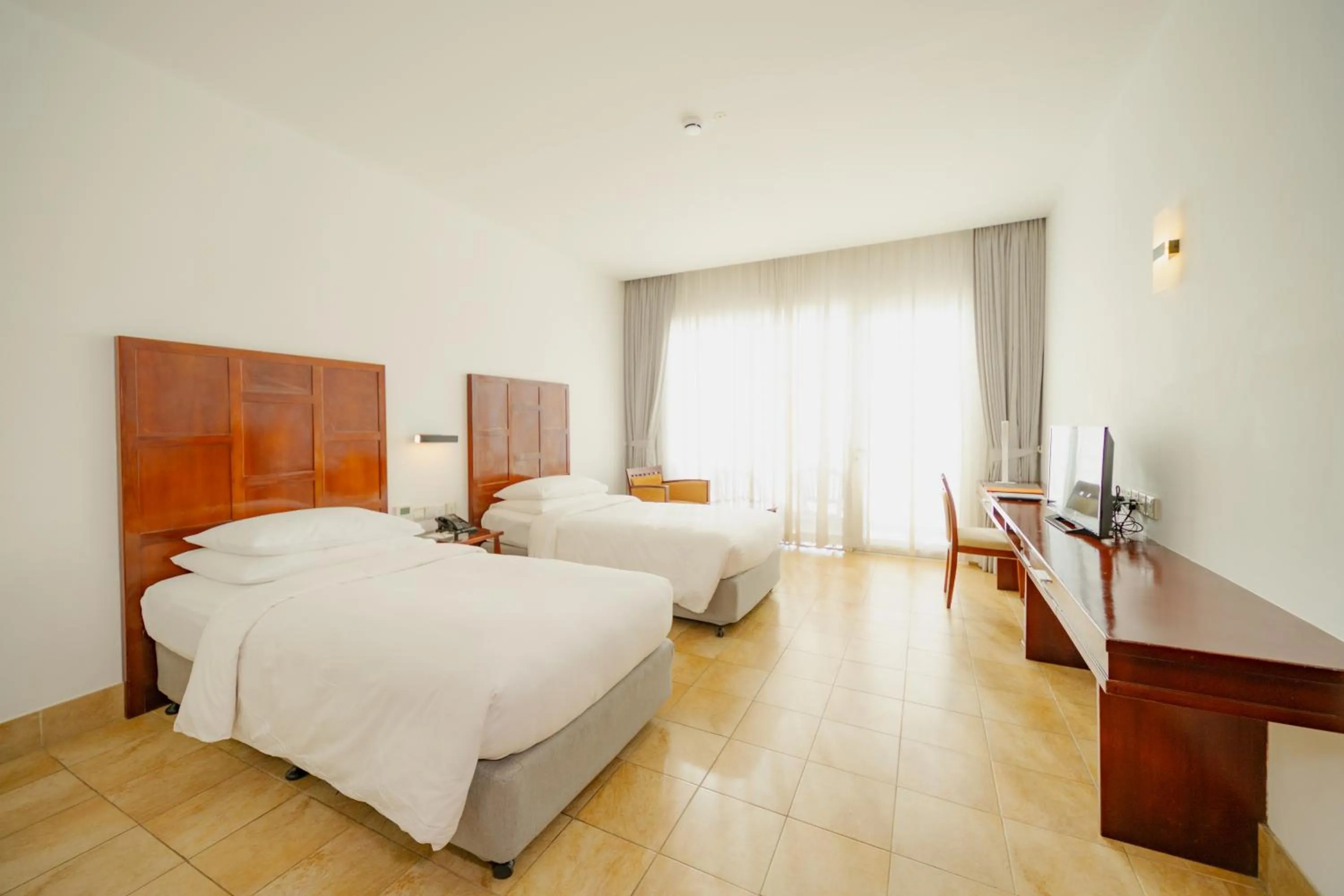 Photo of the whole room, Bed in Hulhule Island Hotel- Private Beach Access & Airport Pick-up and Drop