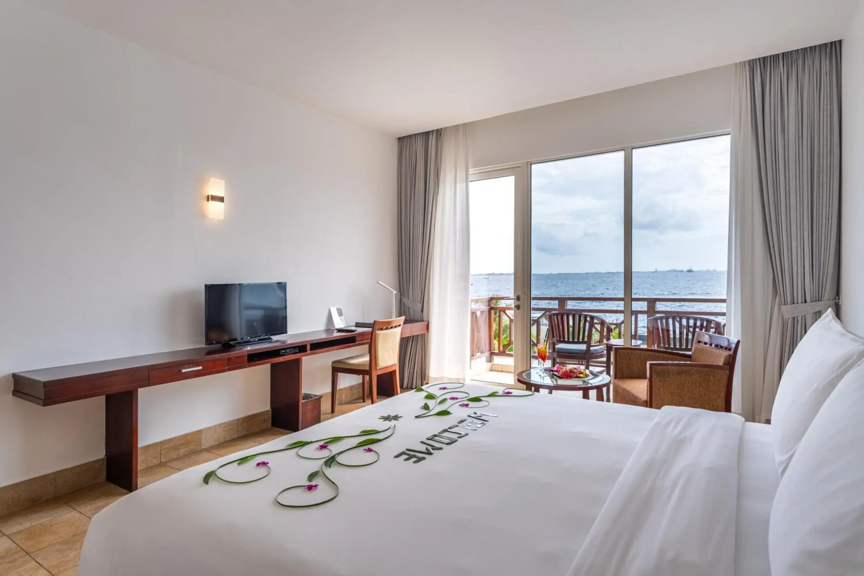 TV and multimedia, Bed in Hulhule Island Hotel- Private Beach Access & Airport Pick-up and Drop TV and multimedia, Bed in Hulhule Island Hotel- Private Beach Access & Airport Pick-up and Drop