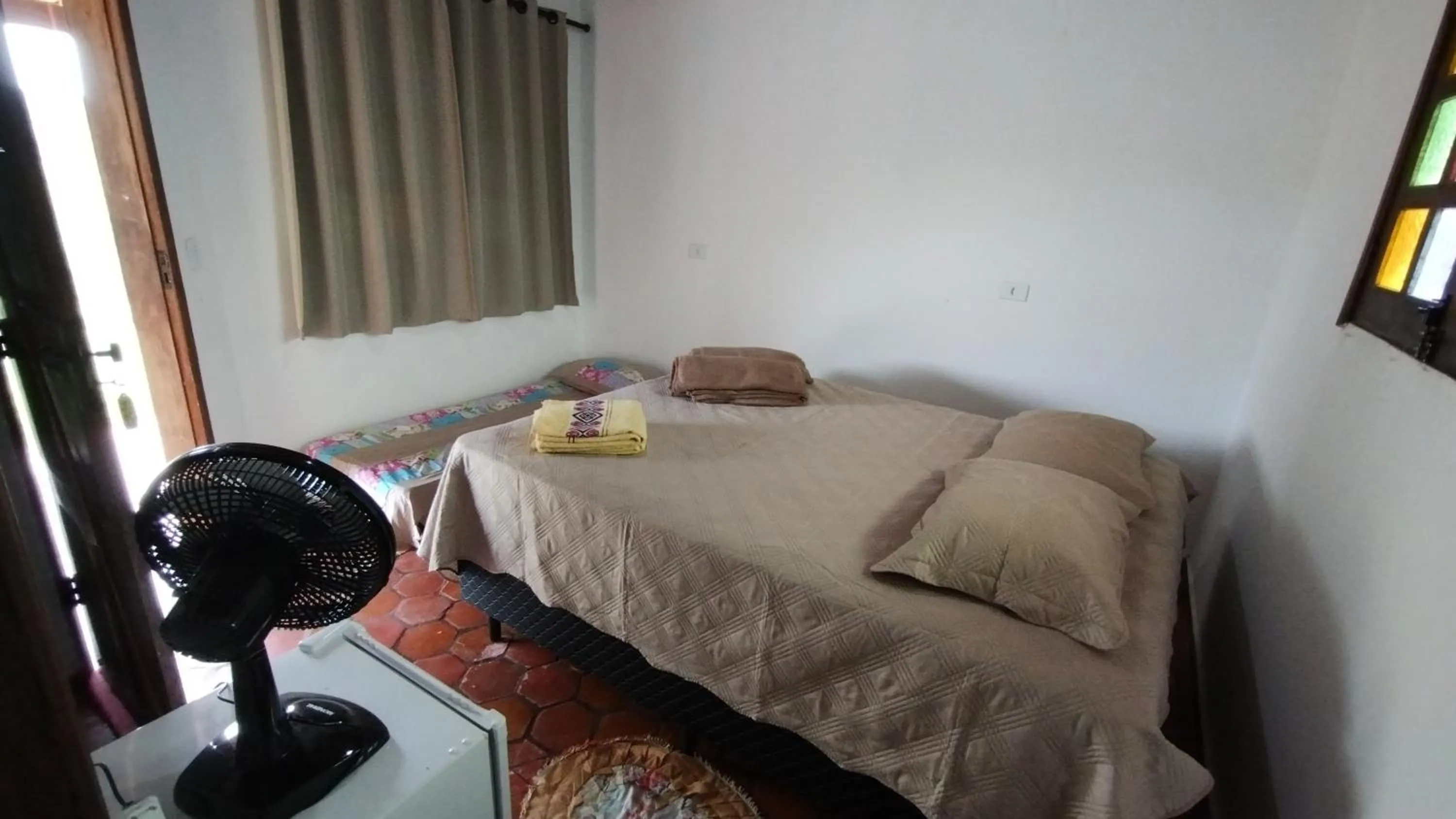 Bed in Pousada Pé do Morro