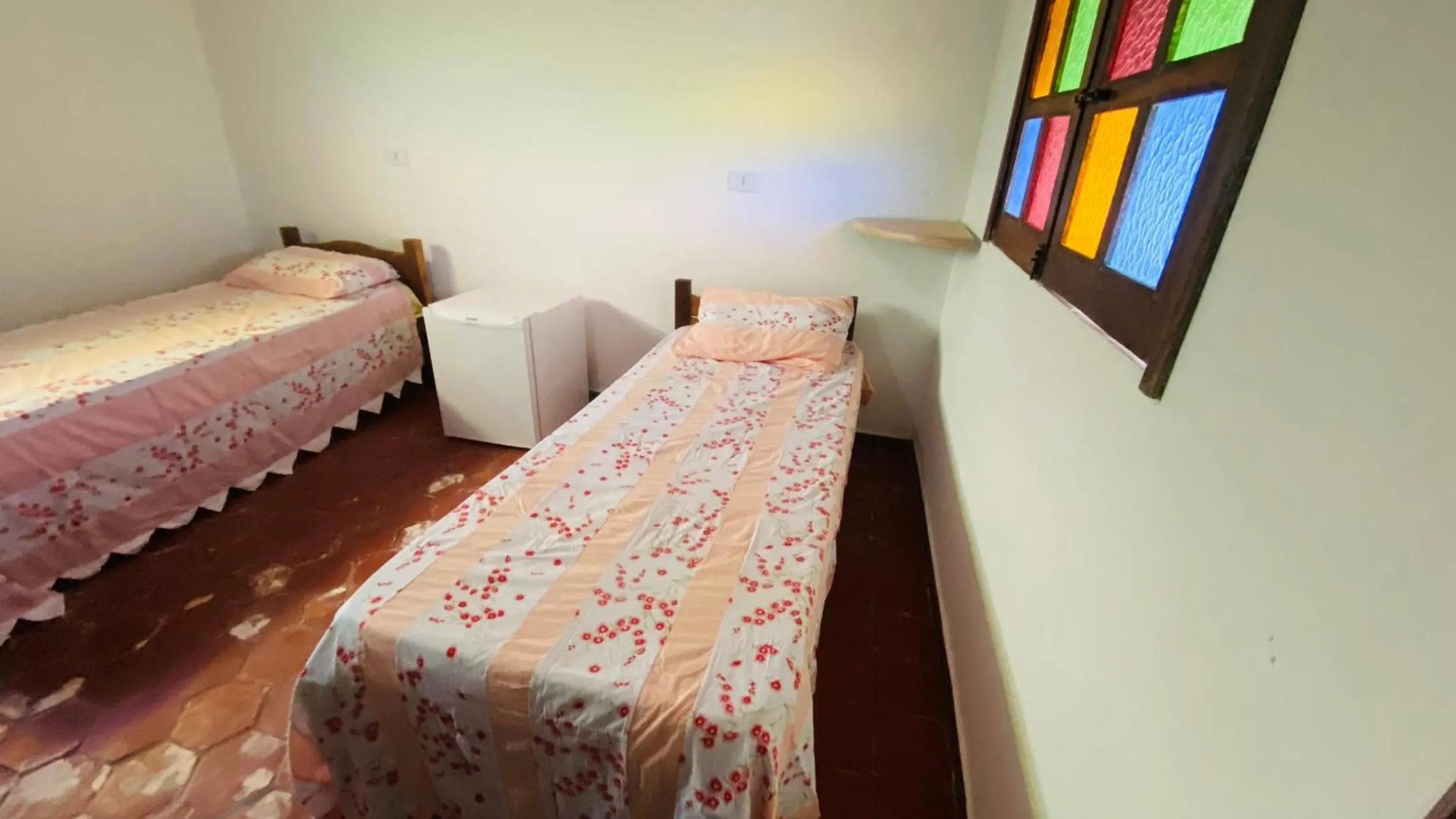 Bed in Pousada Pé do Morro