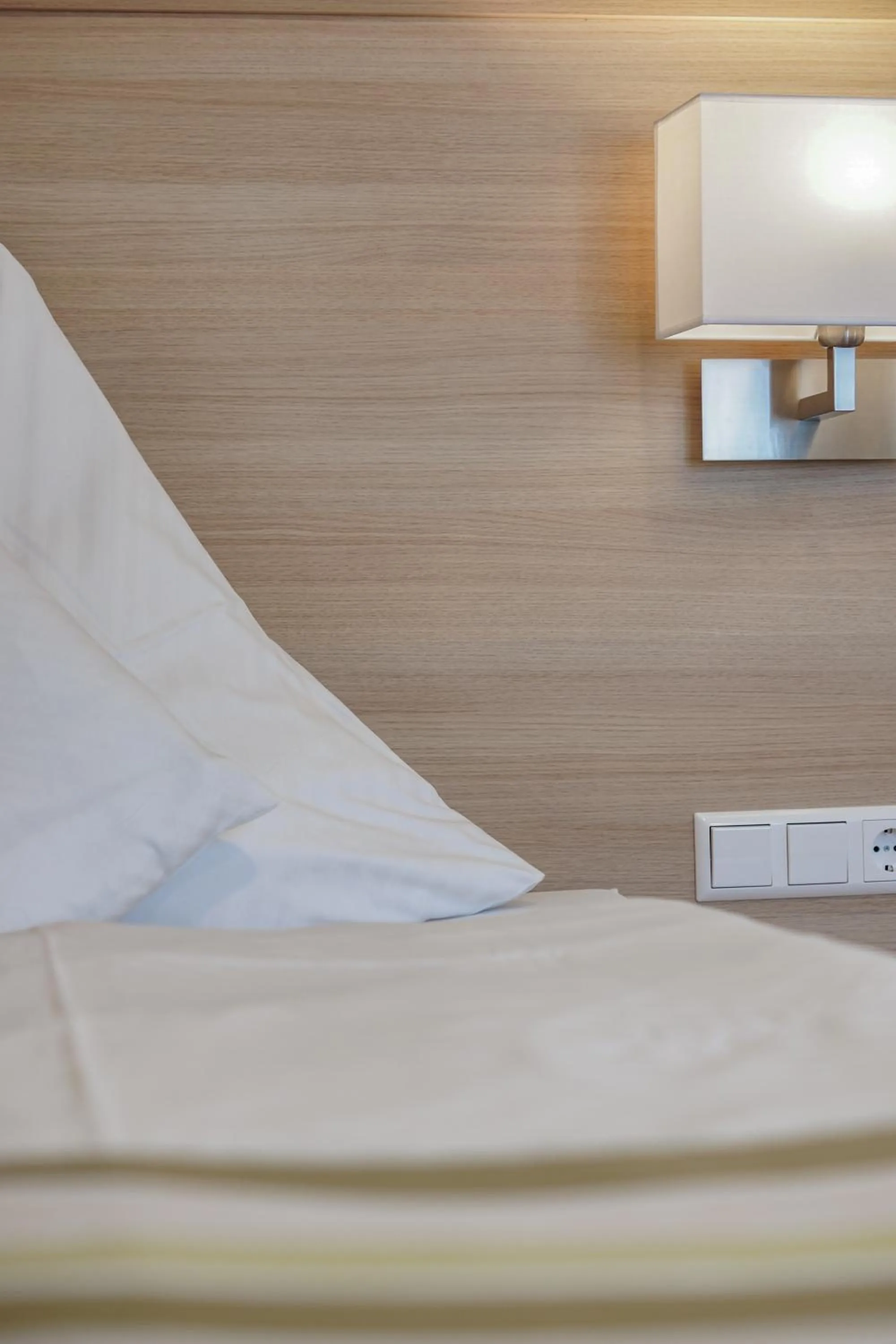 Bed in Hotel Garni in der Breite