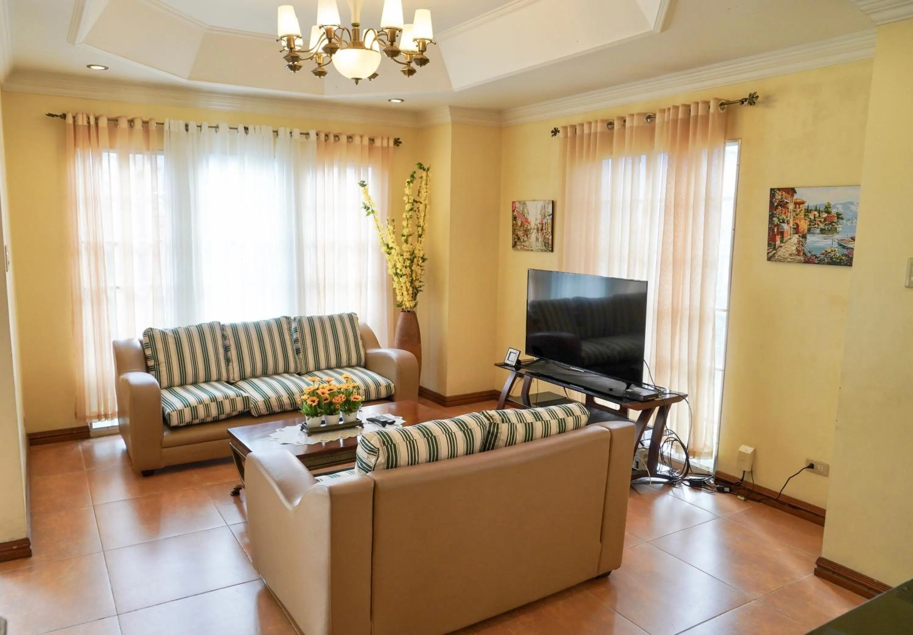 Communal lounge/ TV room in Charming Tagaytay Vacation Home