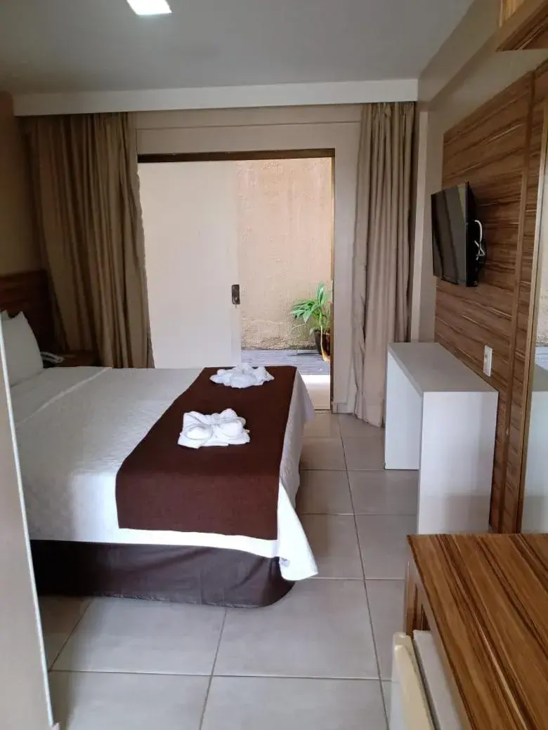 Bed in Pousada Recanto do Lobo Bed in Pousada Recanto do Lobo