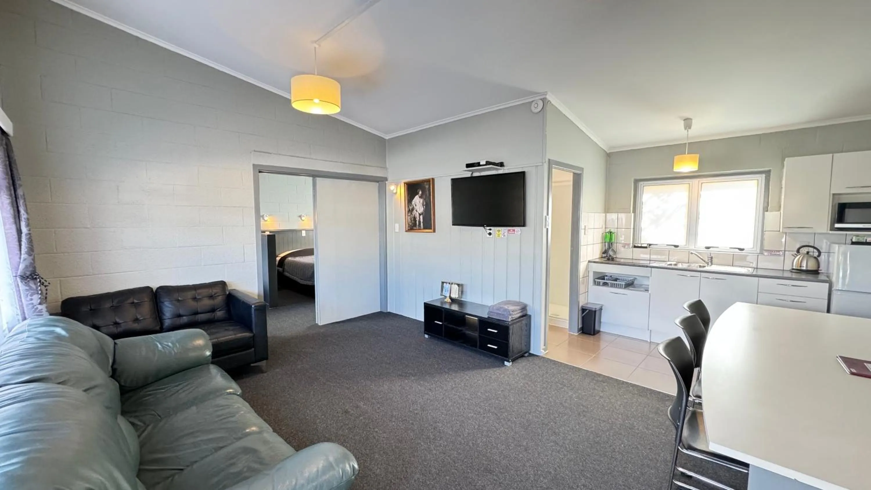 Living room in Central Court Motel