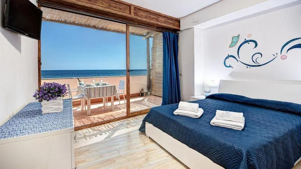 Bed in Belmare Residence on the beach