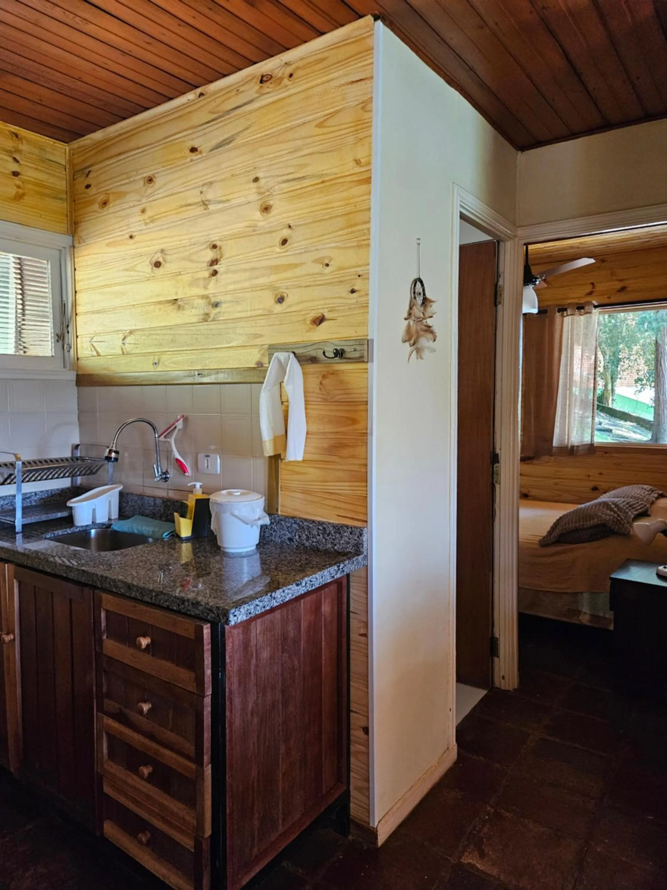 Kitchen or kitchenette, Bed in Chalé Karin Sampaio