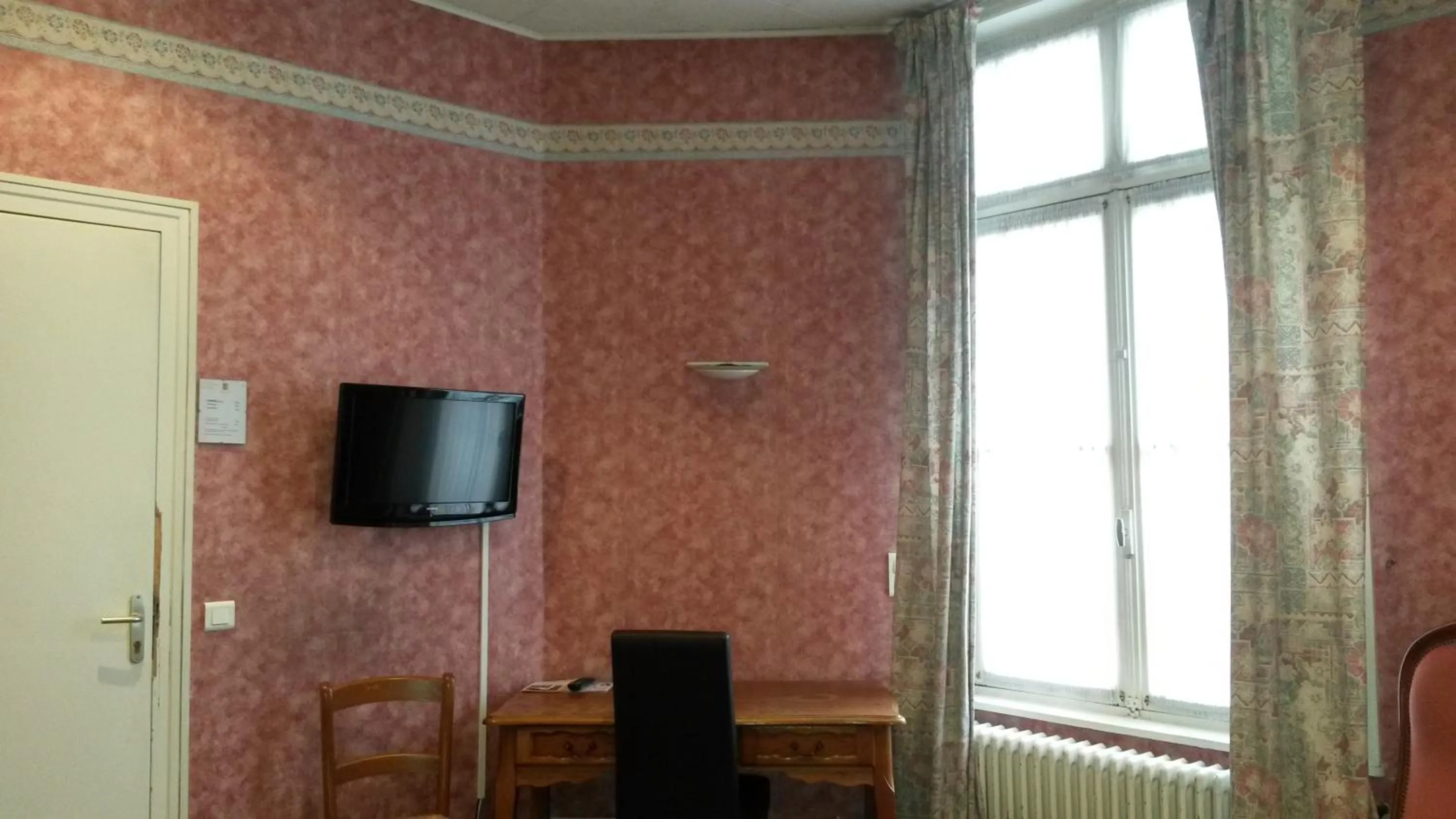 Bedroom in Hôtel De Paris