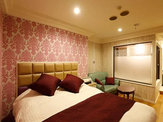 Bed in ホテル マリオン 鈴鹿