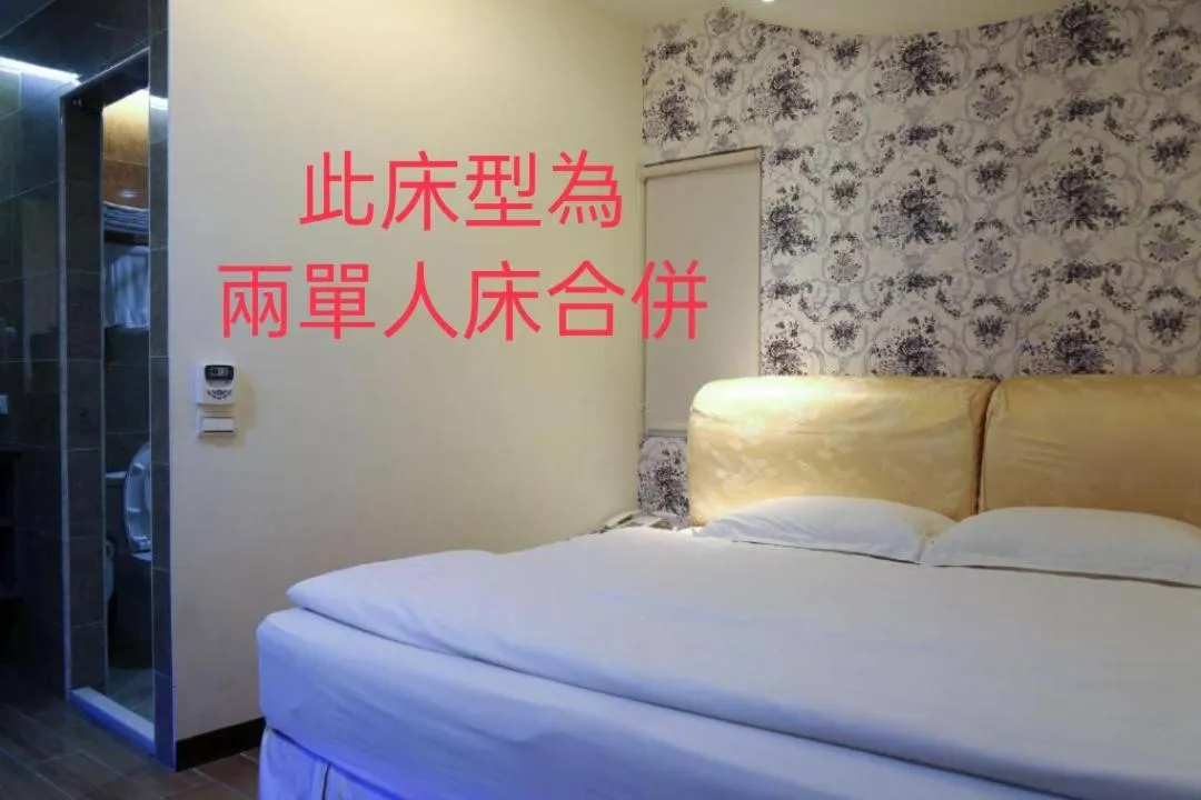 Bed in 德瑞旅店Direct Hotel