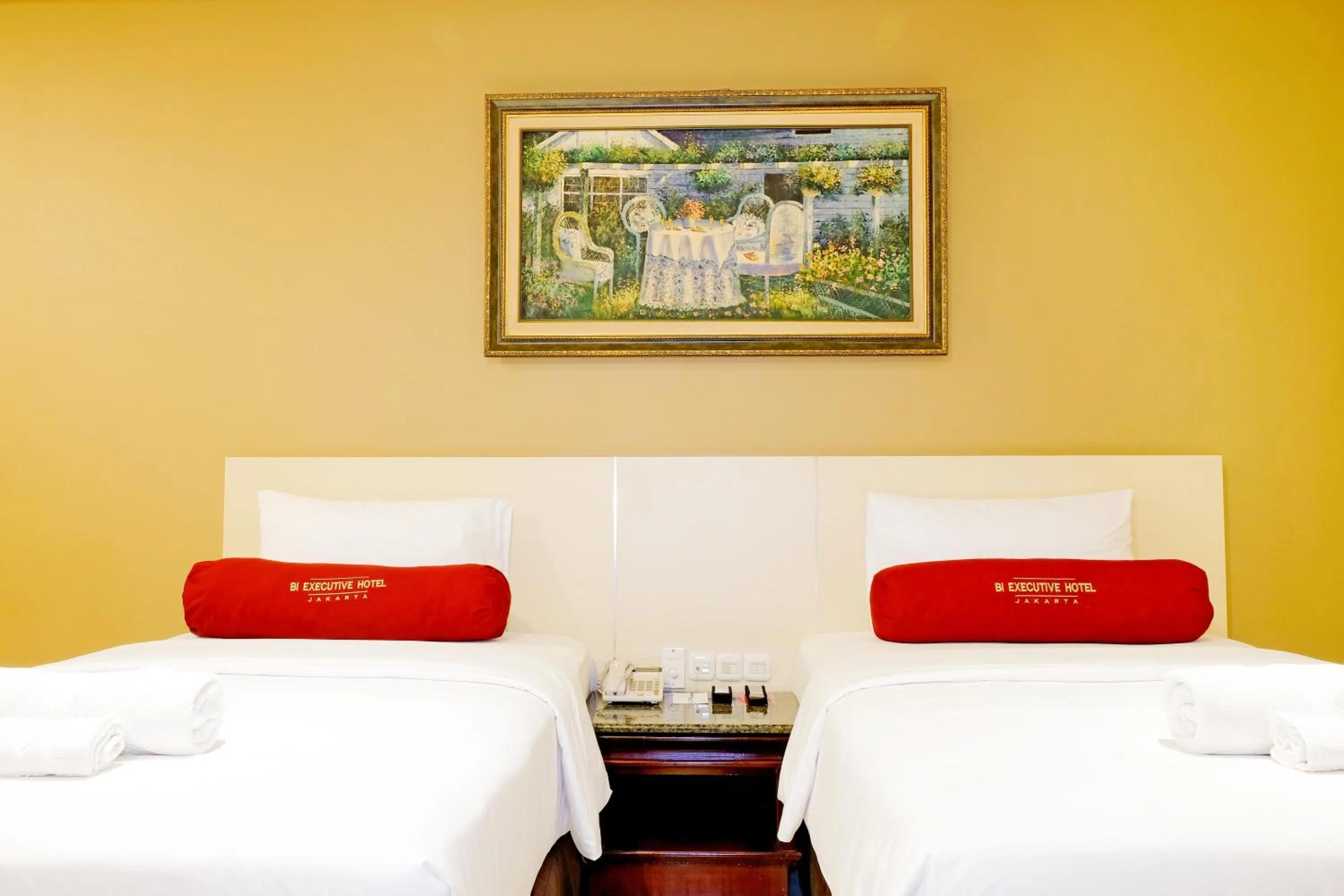 Bed in BI Executive Hotel