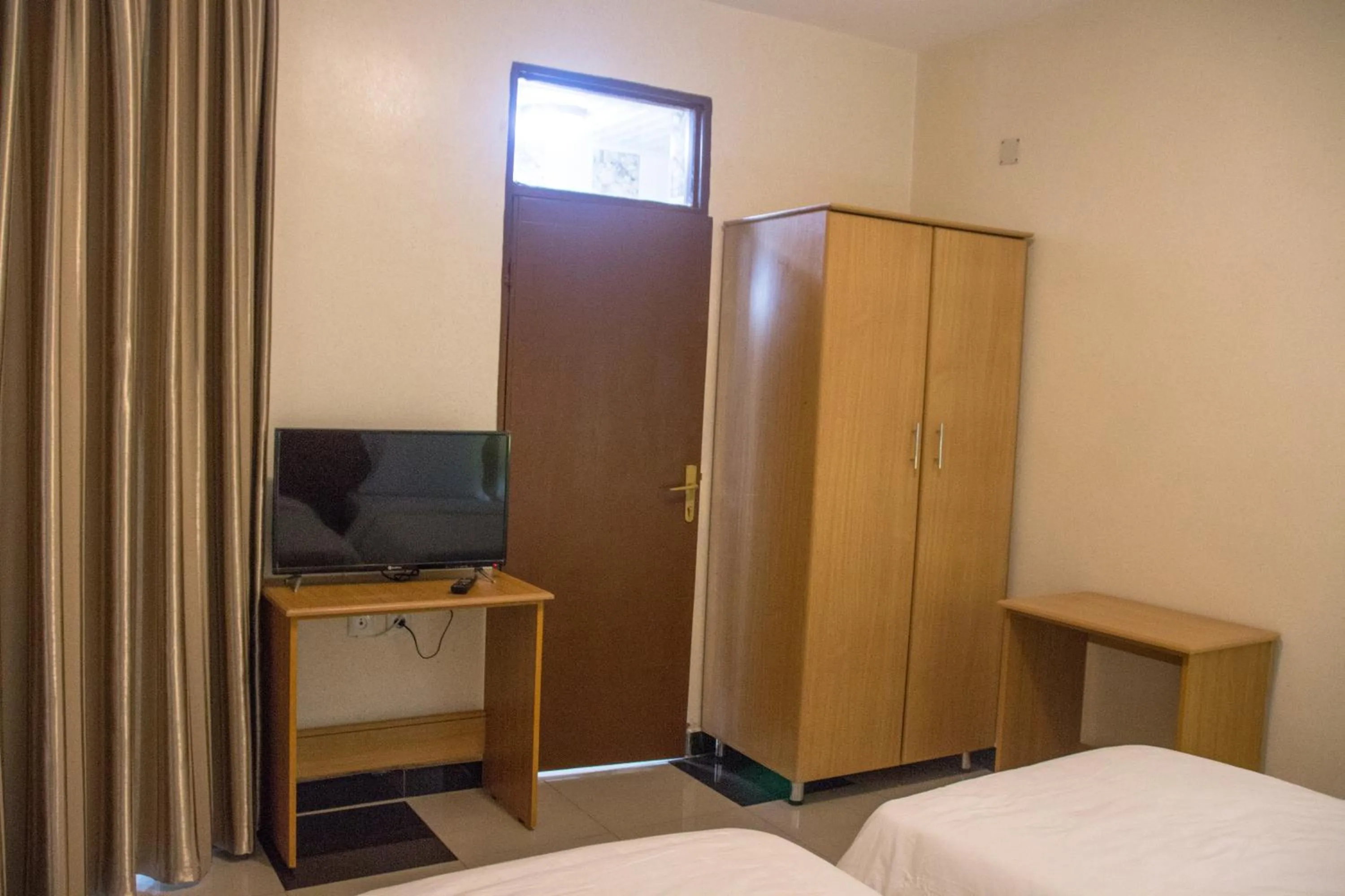 Bed in Anthurium Residential Hotel