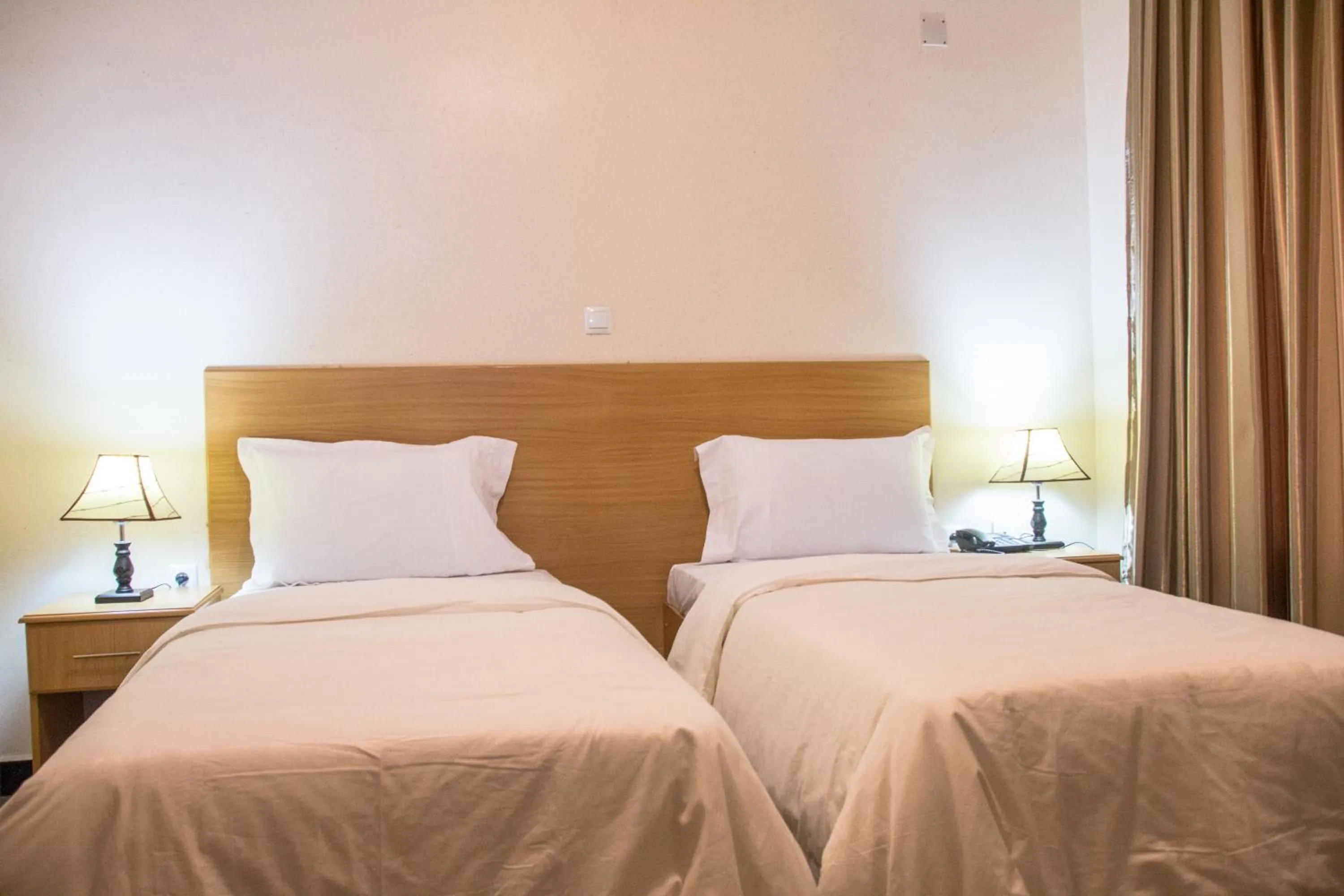 Bed in Anthurium Residential Hotel