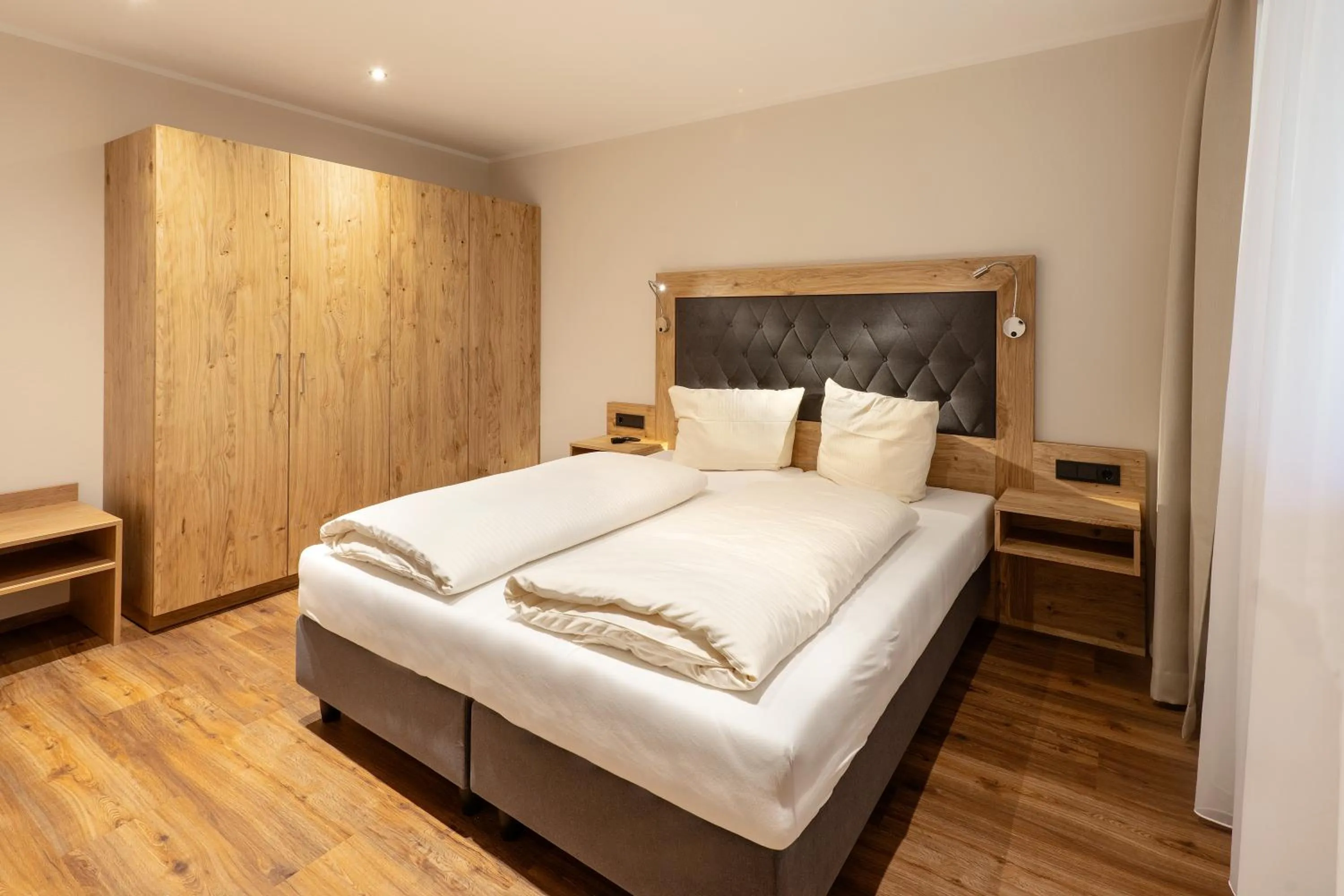 Photo of the whole room, Bed in Golf- und Sporthotel Moarhof