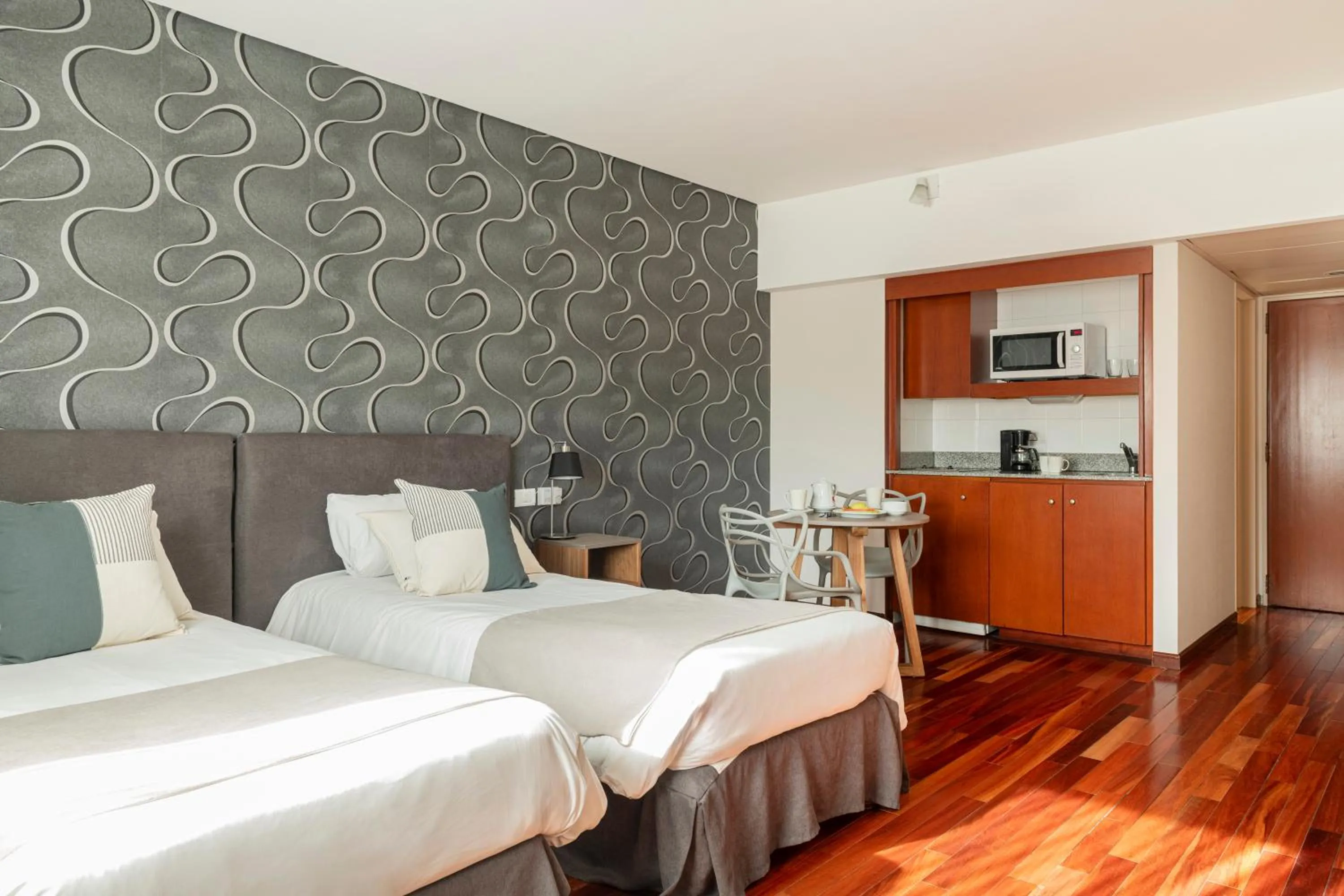 Bed in Argenta Tower Hotel & Suites