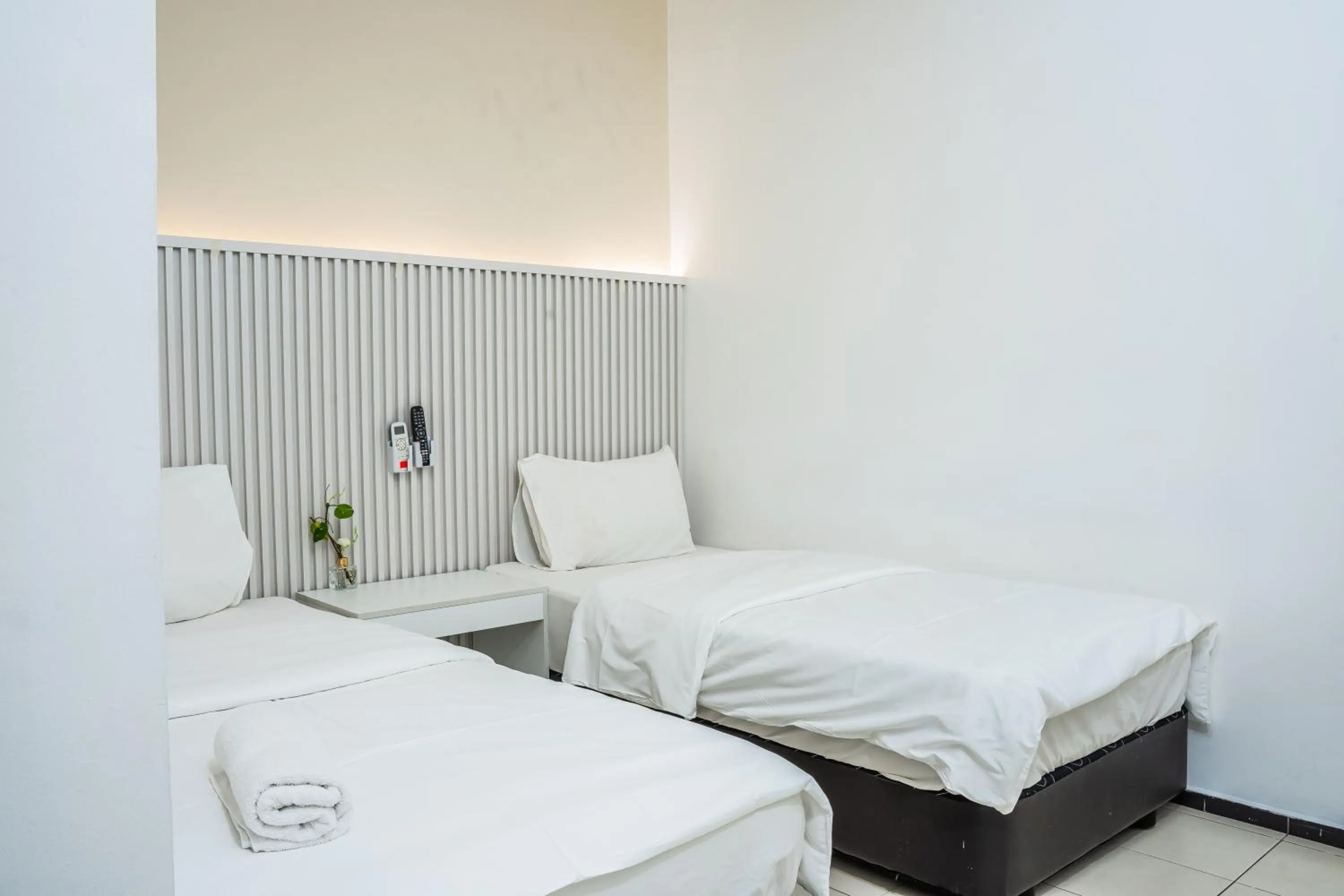 Bed in Ihome Boutique Hotel