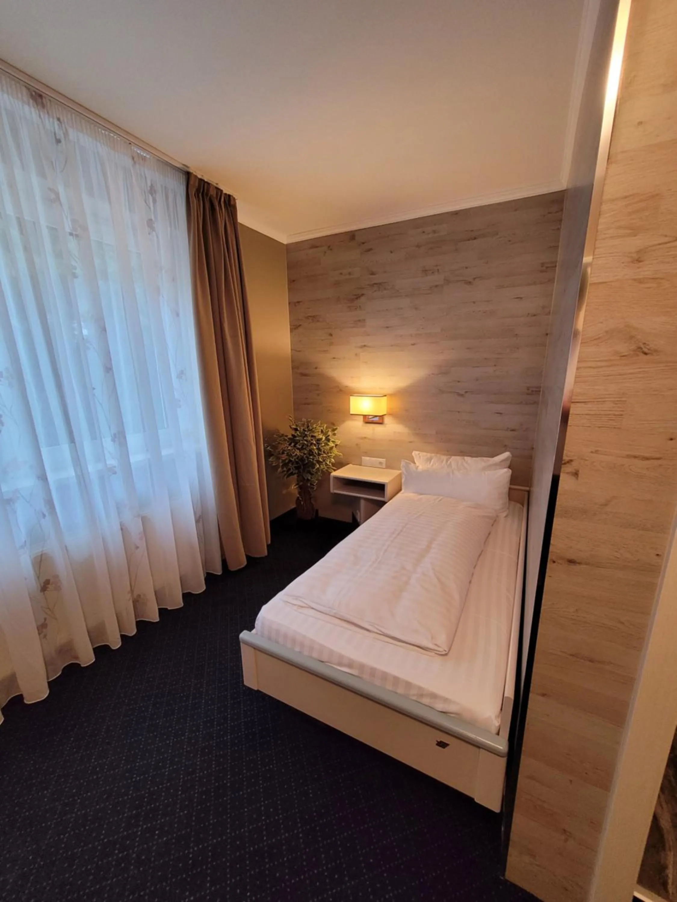 Bed in Ambiente Hotel garni