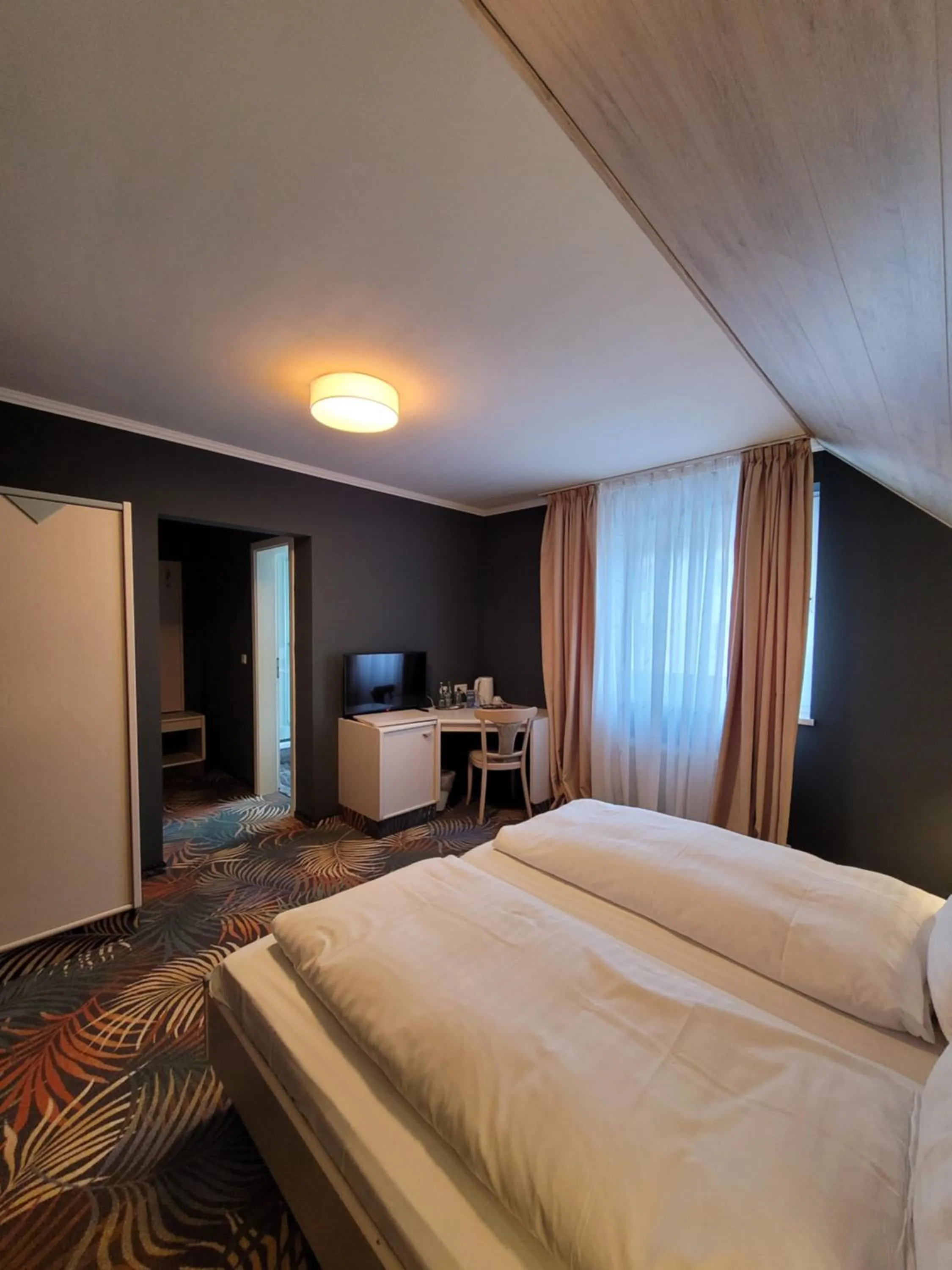 Bed in Ambiente Hotel garni