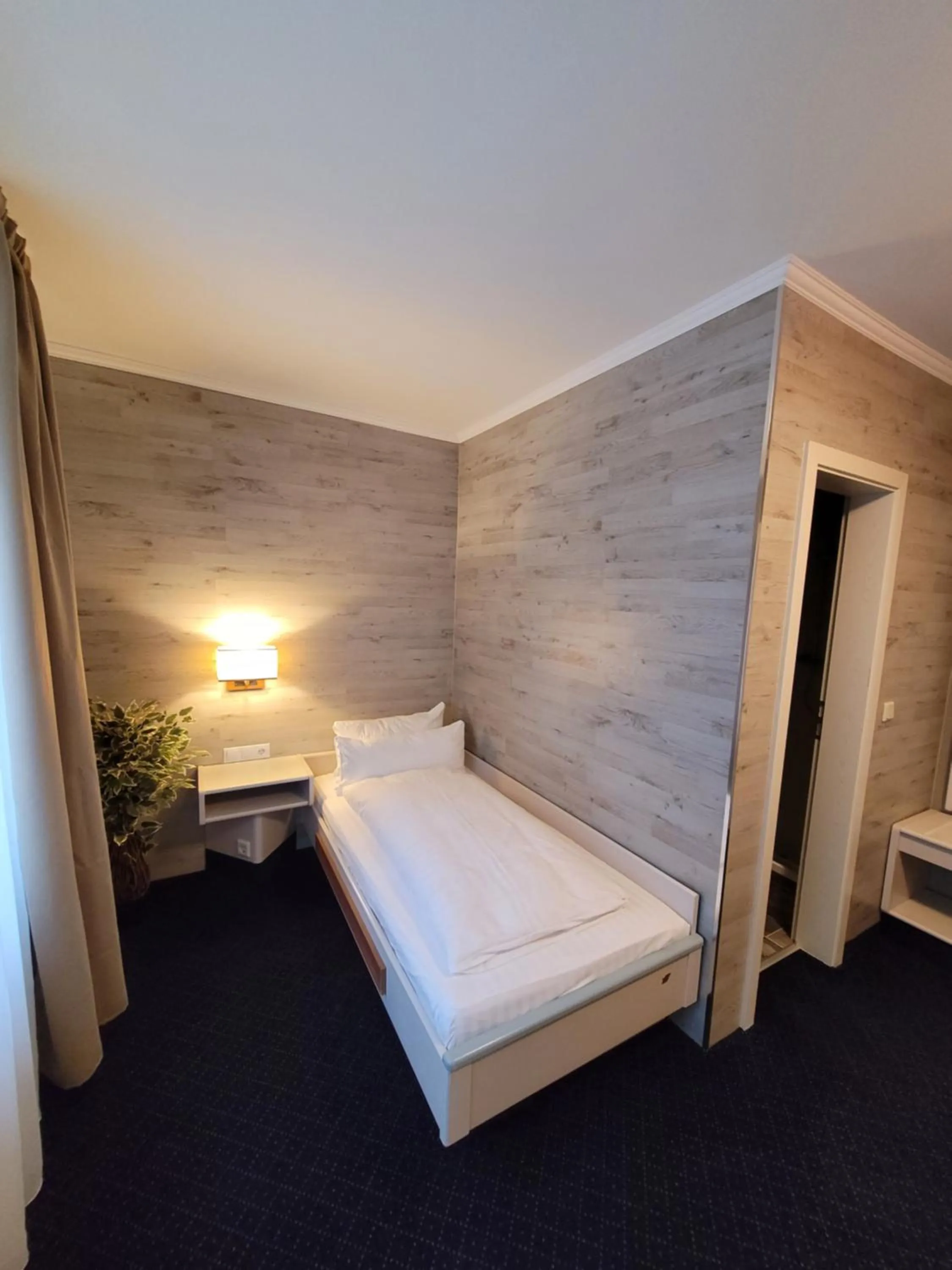 Bed in Ambiente Hotel garni