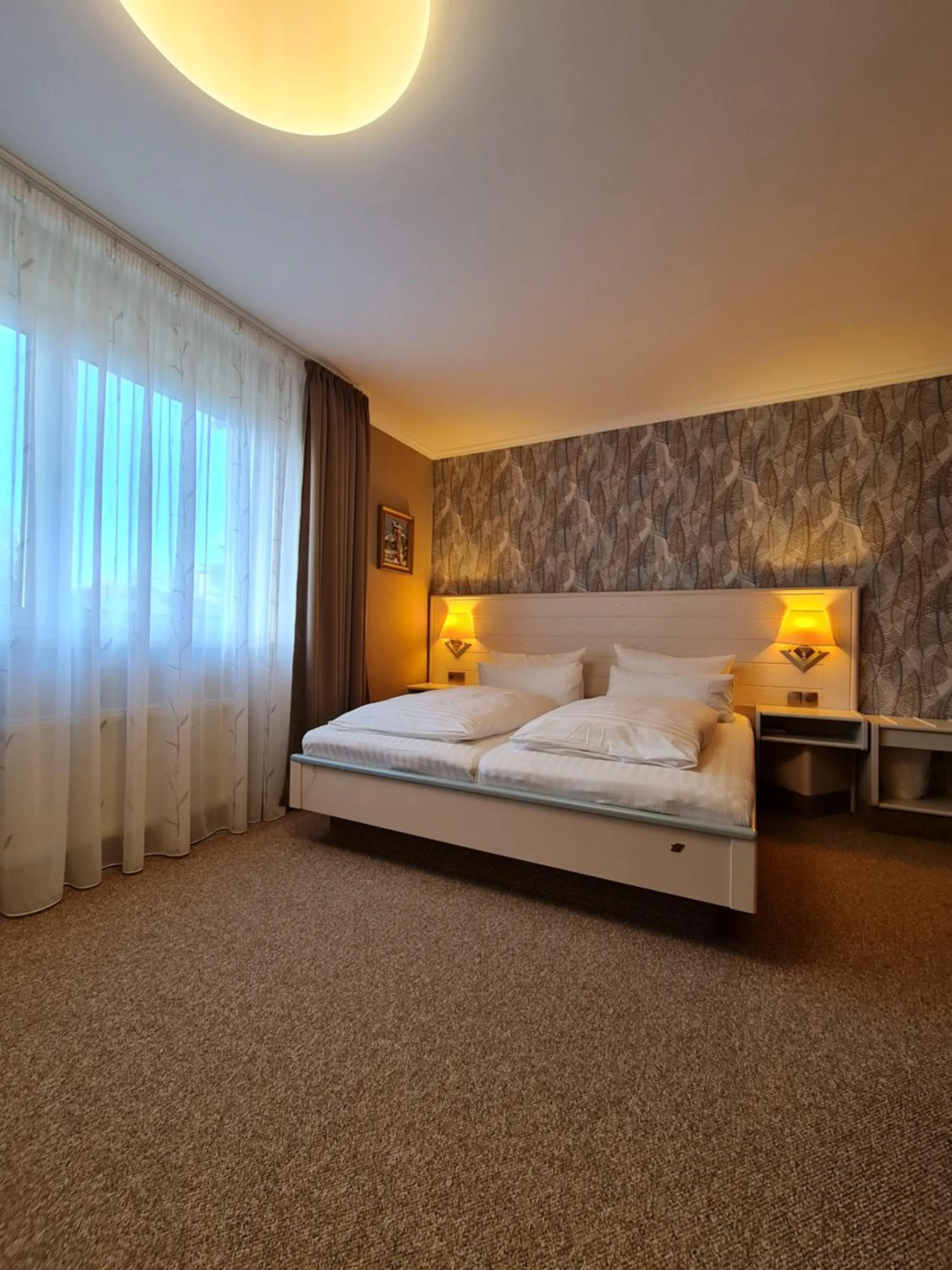 Bed in Ambiente Hotel garni