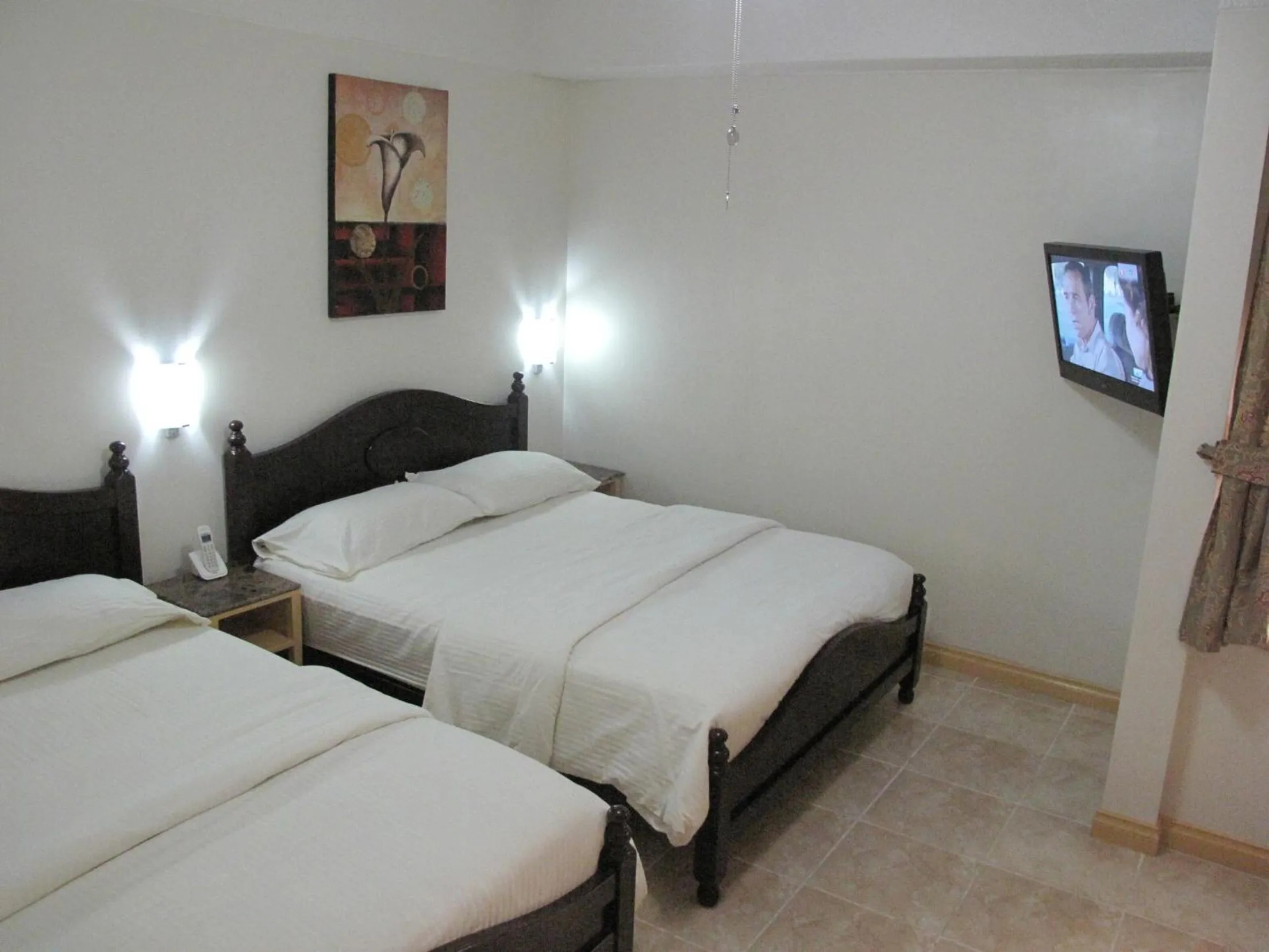 Bed in Makati Suites at Travelers Inn