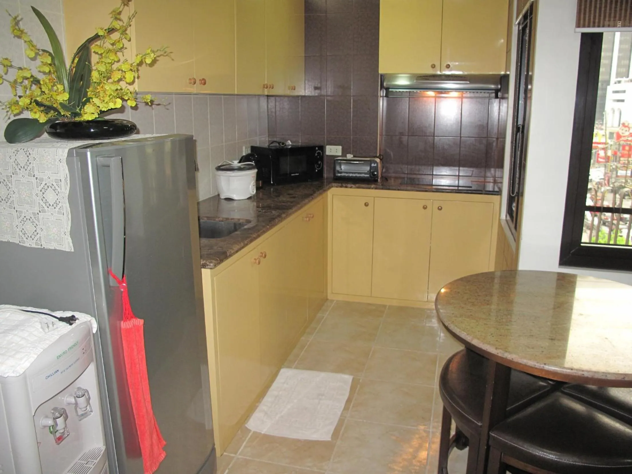 Kitchen or kitchenette in Makati Suites at Travelers Inn
