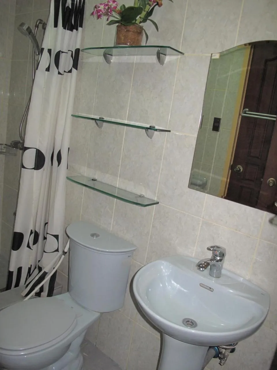 Shower in Makati Suites at Travelers Inn