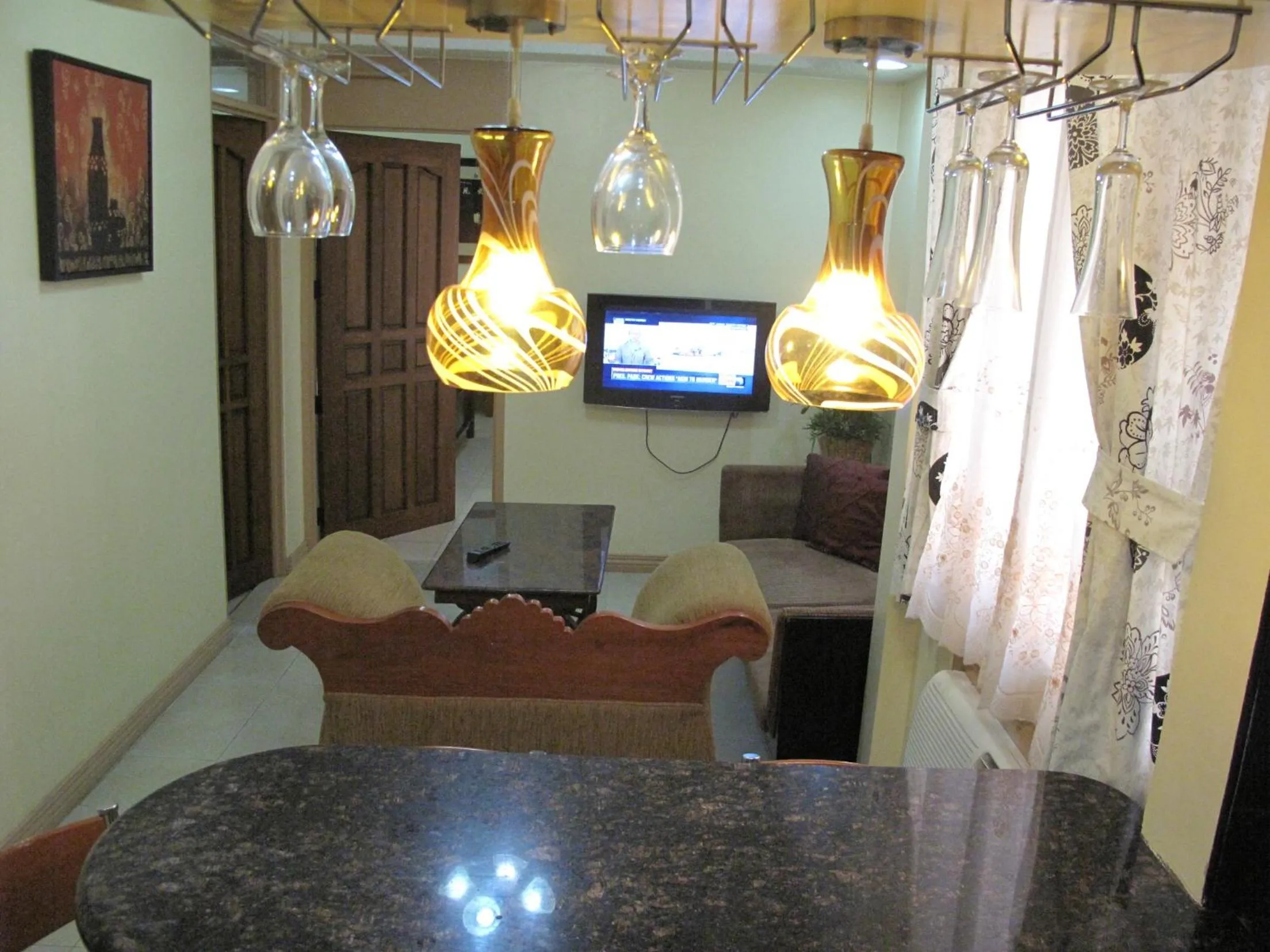 TV and multimedia in Makati Suites at Travelers Inn