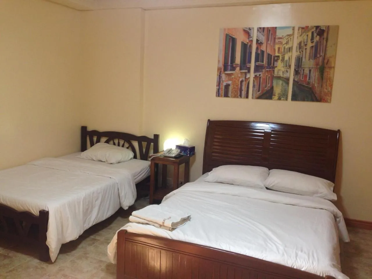 Bed in Makati Suites at Travelers Inn