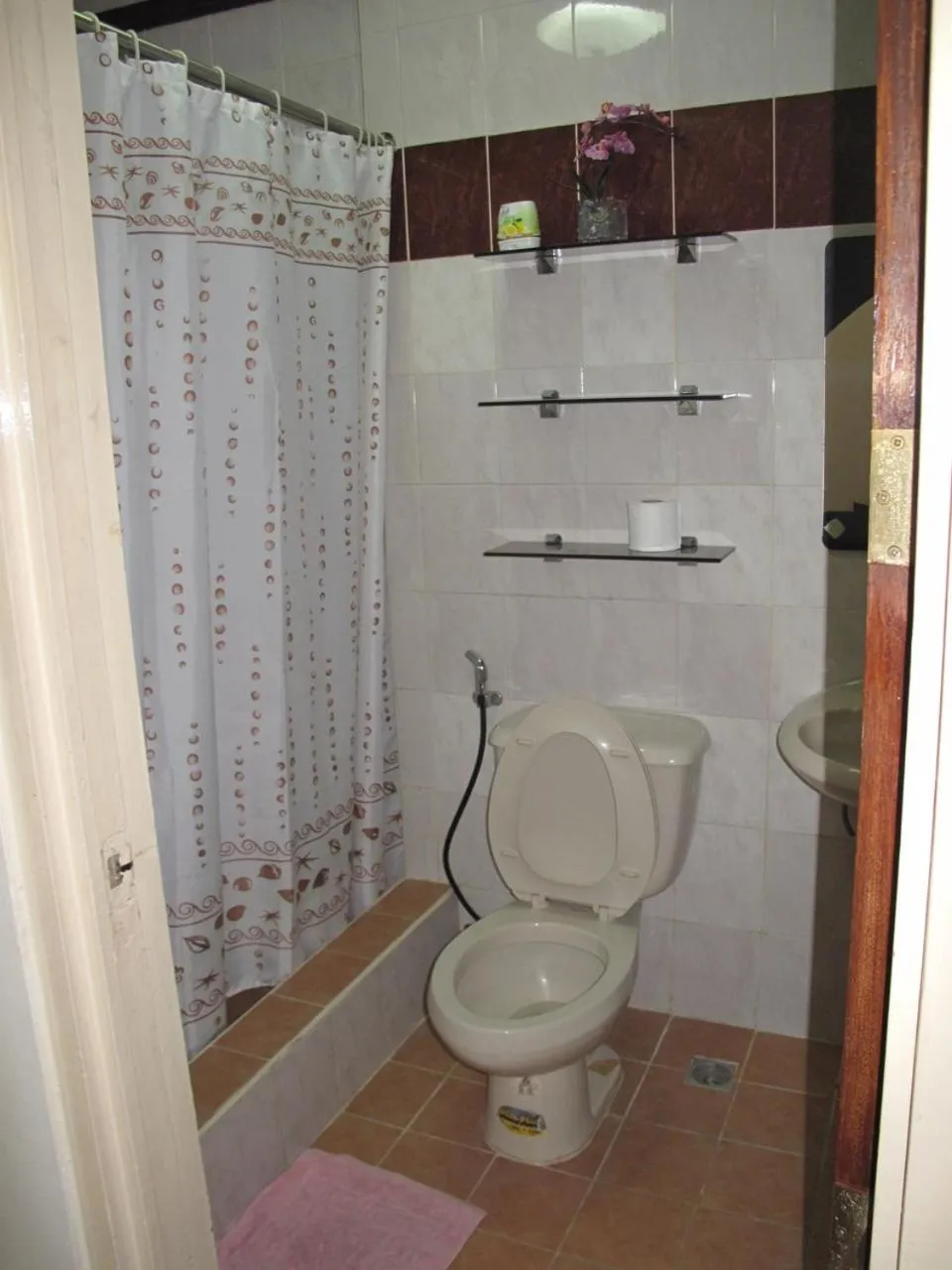 Toilet in Makati Suites at Travelers Inn