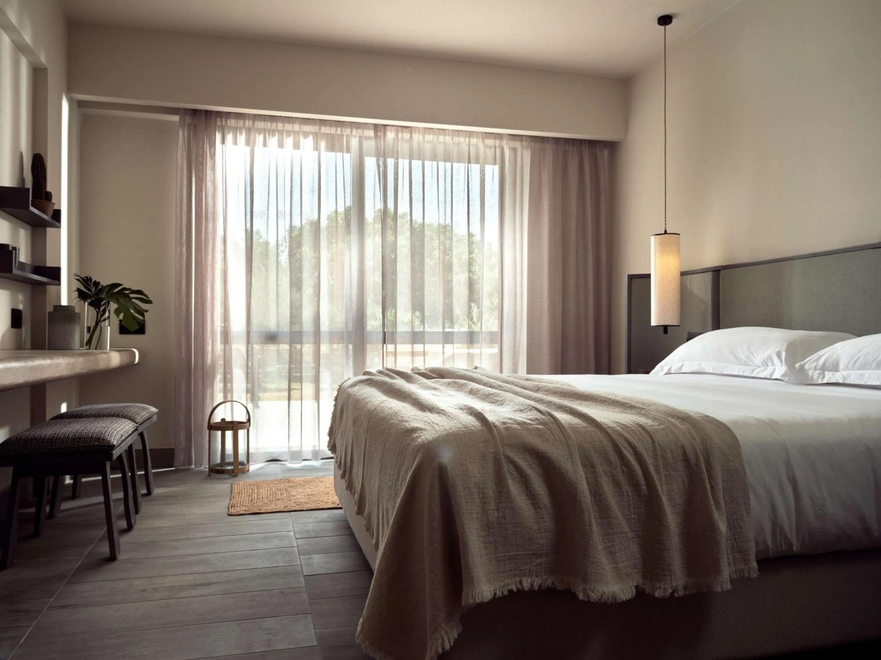 Bed in Numo Ierapetra Beach Resort Crete, Adults only, Curio Collection Hilton